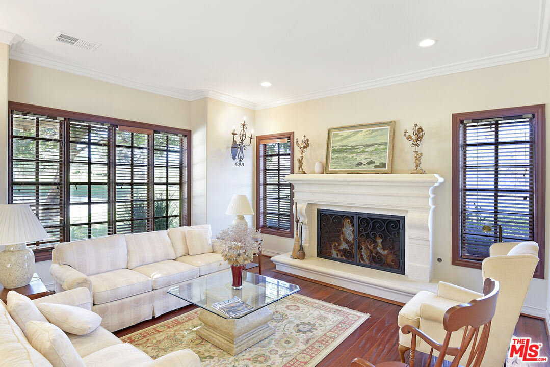 480 Westlake Boulevard Malibu, CA 90265 - Photo 6 of 36 a living room with furniture and a fireplace