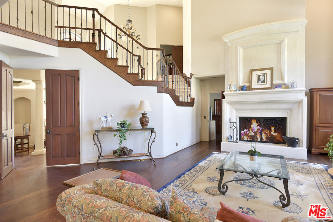 480 Westlake Boulevard Malibu, CA 90265 - Photo 10 of 36 a living room with furniture and a fireplace