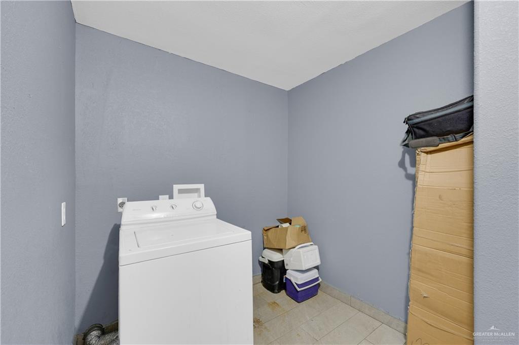 537 Benito Street Rio Grande City, TX 78582 - Photo 11 of 20 a utility room with dryer and washer