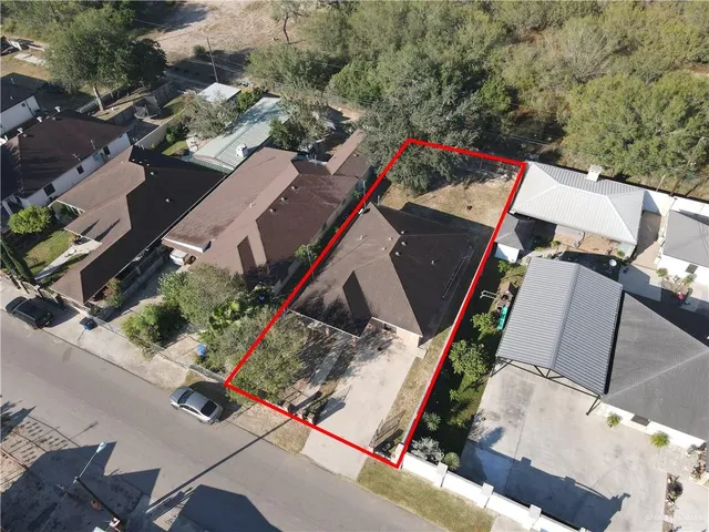 an aerial view of residential houses with outdoor space