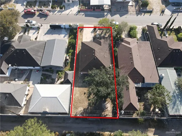 an aerial view of a house with a lake view