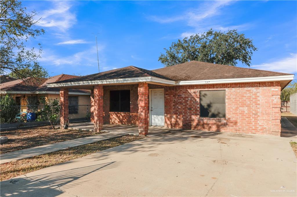 537 Benito Street Rio Grande City, TX 78582 - Photo 2 of 20 a front view of a house with a garden