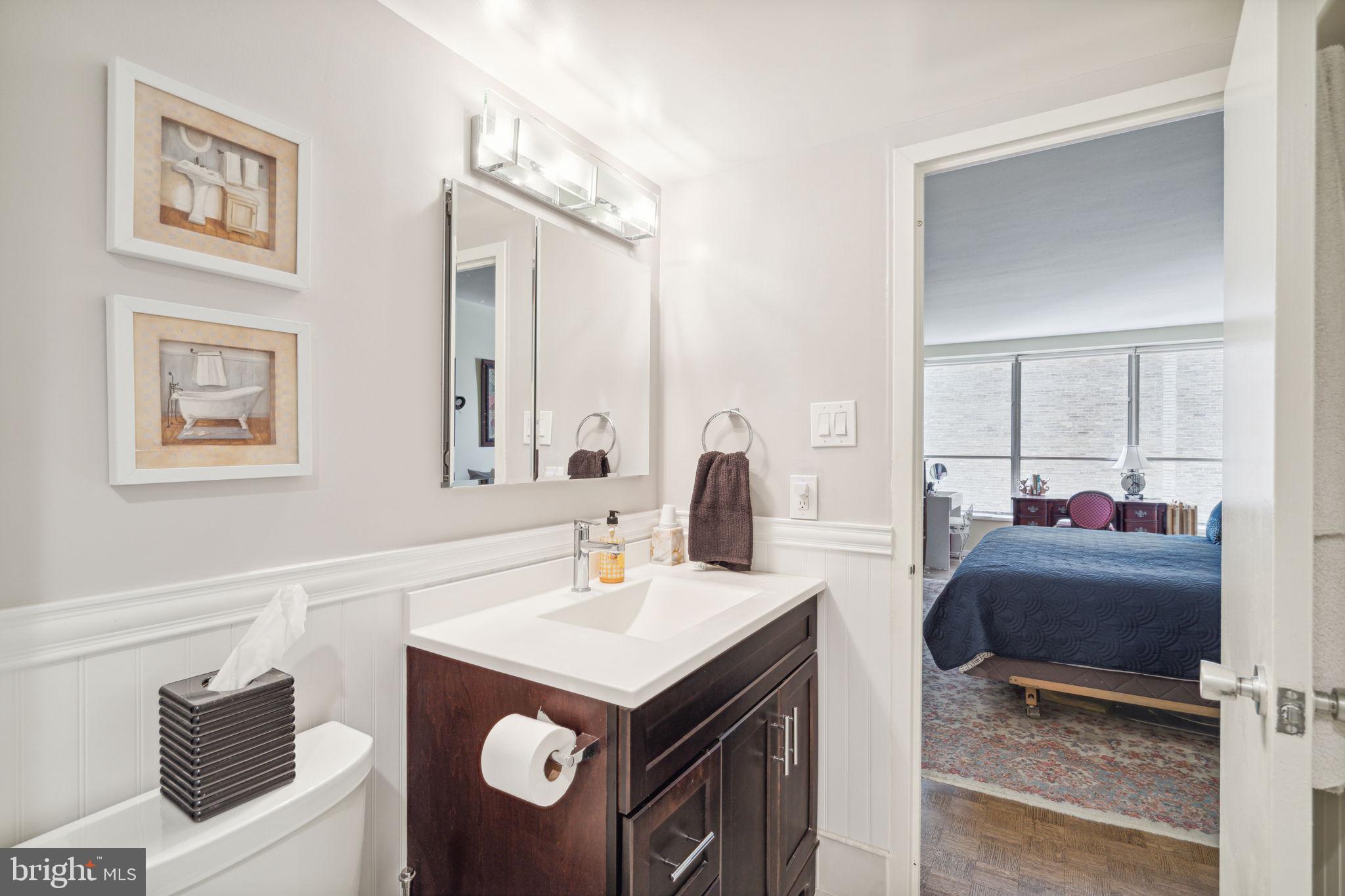 224-30 West Rittenhouse Square, Unit 1201 Philadelphia, PA 19103 - Photo 20 of 34 a bathroom with a sink and a mirror
