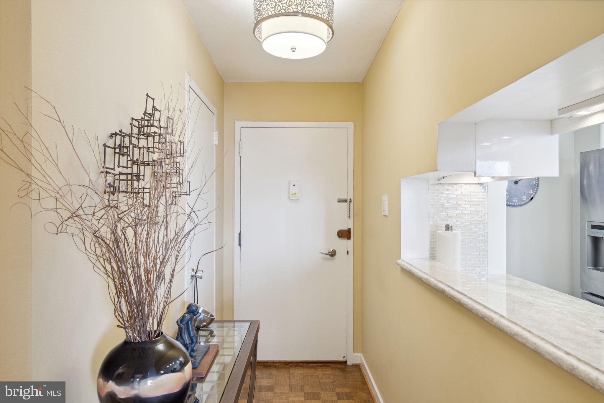 224-30 West Rittenhouse Square, Unit 1201 Philadelphia, PA 19103 - Photo 2 of 34 a bathroom with a sink a toilet and shower curtain