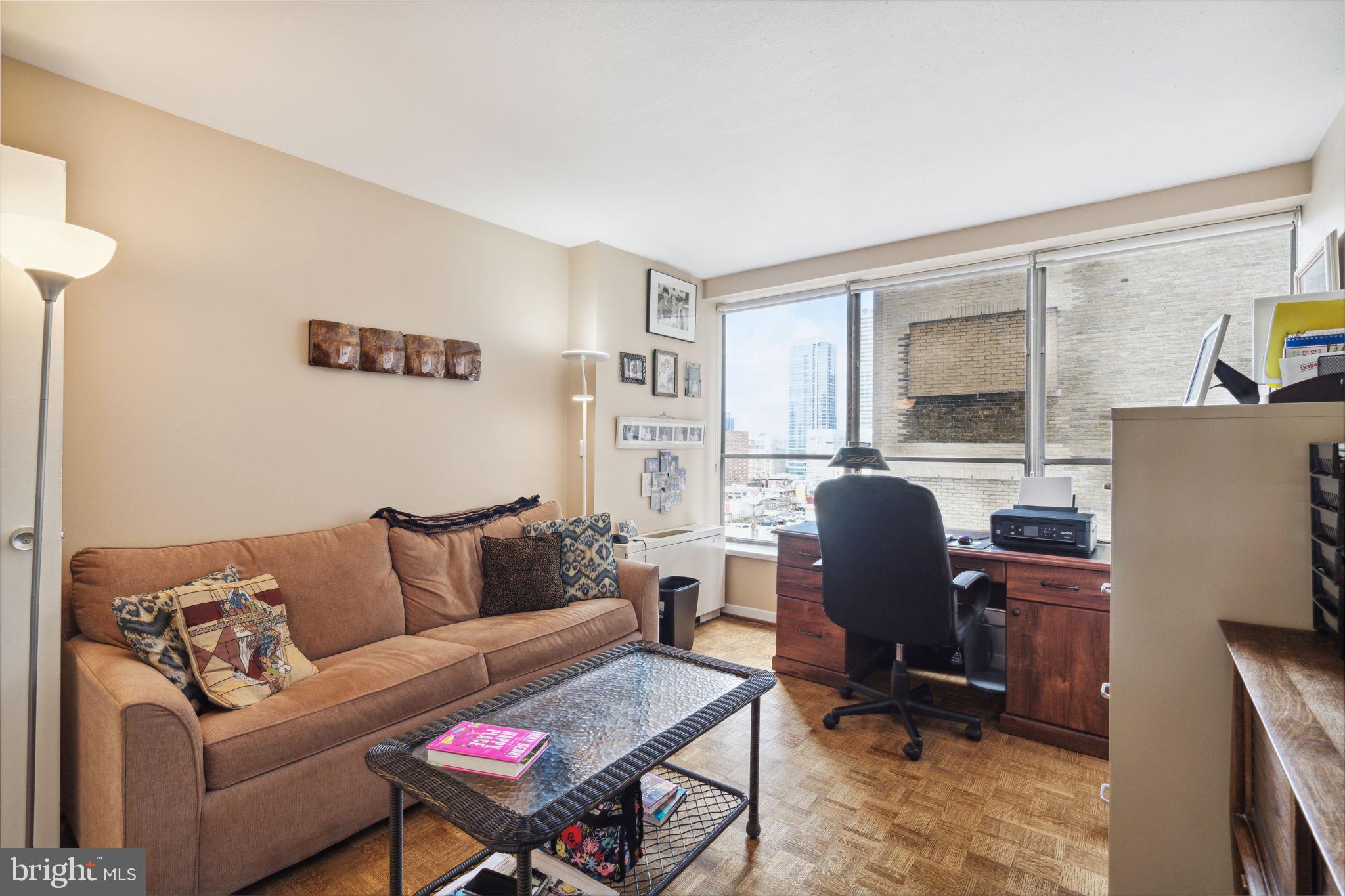 224-30 West Rittenhouse Square, Unit 1201 Philadelphia, PA 19103 - Photo 23 of 34 a living room with furniture and a workspace