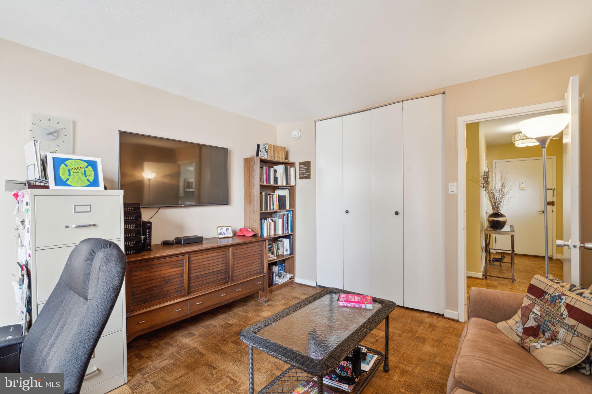 224-30 West Rittenhouse Square, Unit 1201 Philadelphia, PA 19103 - Photo 24 of 34 a living room with furniture and a flat screen tv