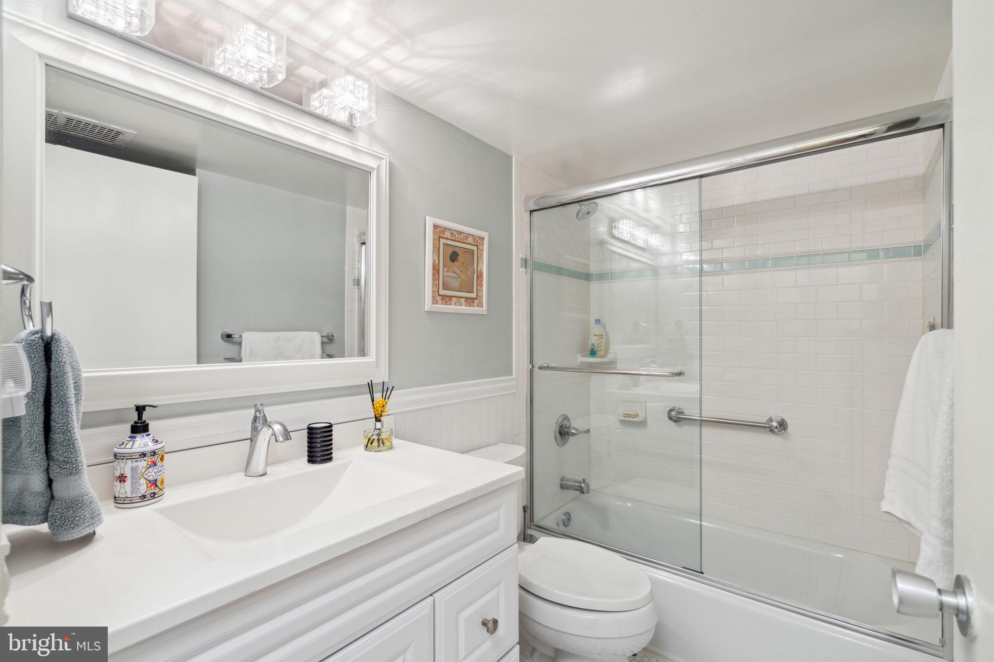 224-30 West Rittenhouse Square, Unit 1201 Philadelphia, PA 19103 - Photo 25 of 34 a bathroom with a sink a toilet and shower