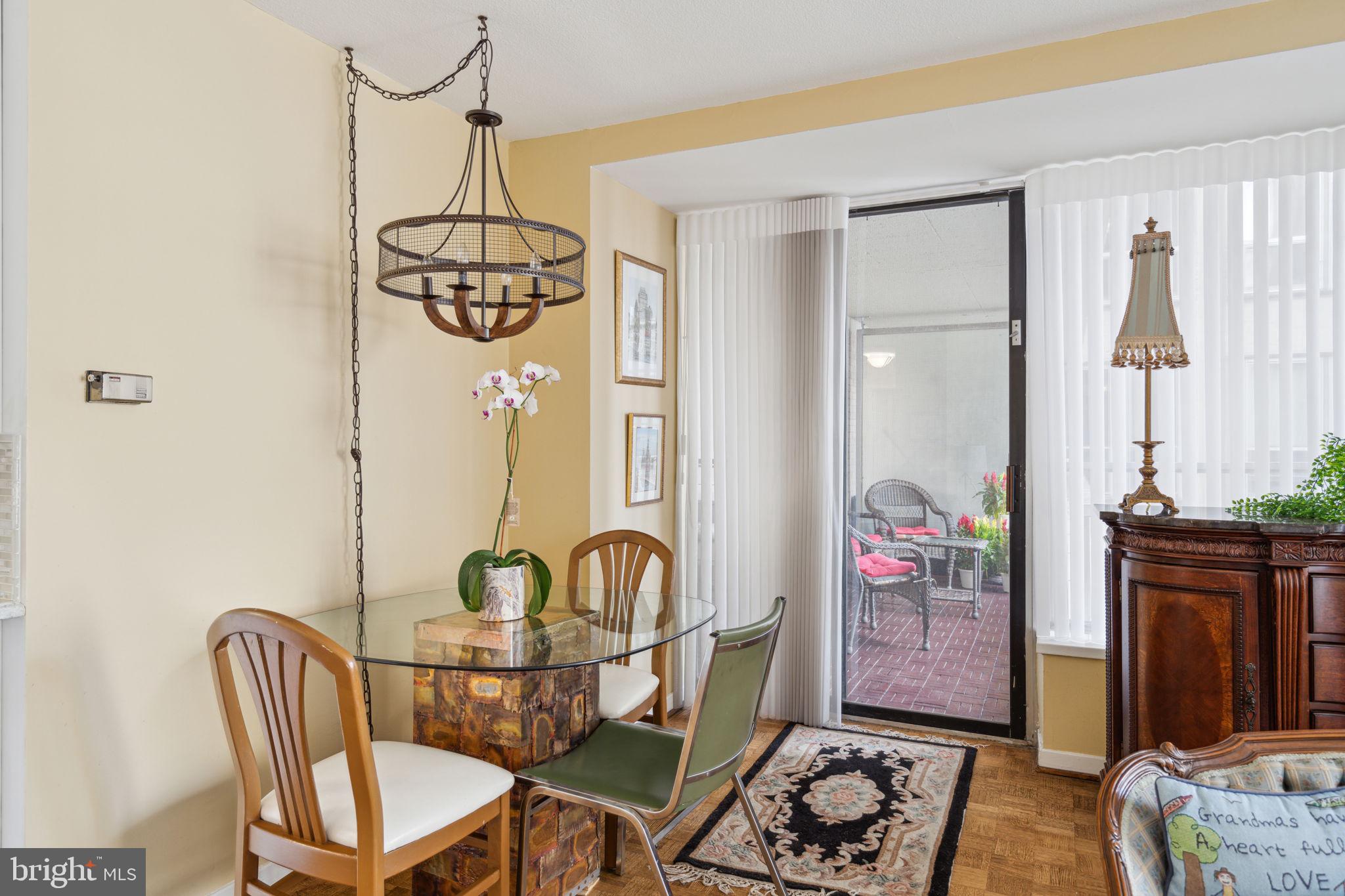 224-30 West Rittenhouse Square, Unit 1201 Philadelphia, PA 19103 - Photo 8 of 34 a view of a dining room with furniture and chandelier