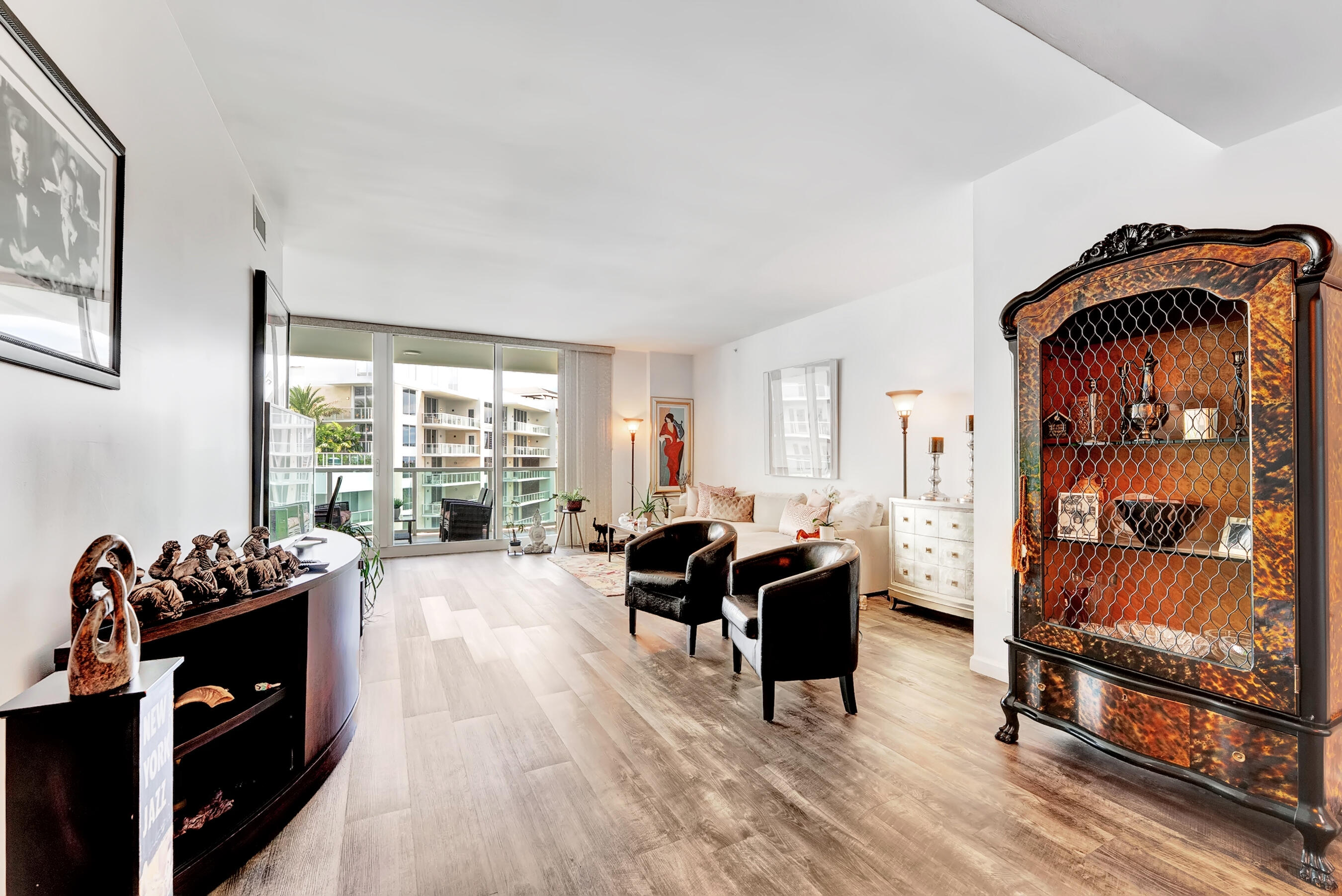 500 Southeast Mizner Boulevard, Unit A710 Boca Raton, FL 33432 - Photo 14 of 50 a living room with furniture a rug and a floor to ceiling window