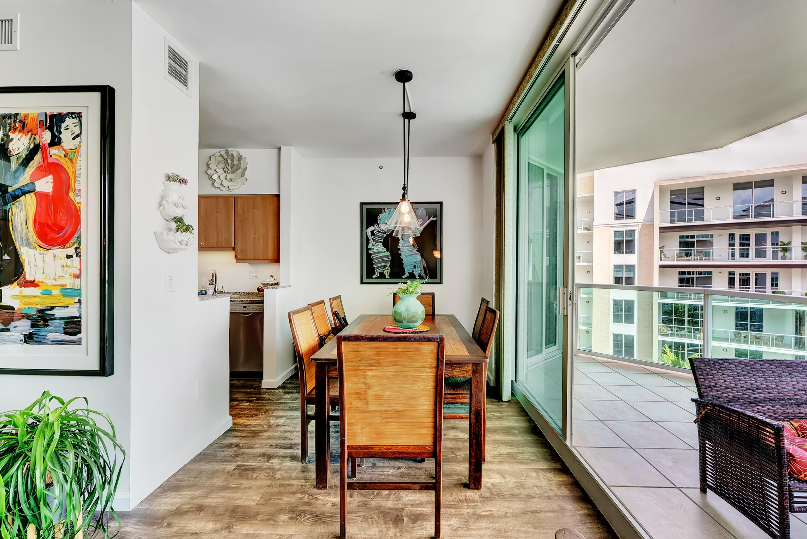 500 Southeast Mizner Boulevard, Unit A710 Boca Raton, FL 33432 - Photo 22 of 50 a dining room with furniture and wooden floor