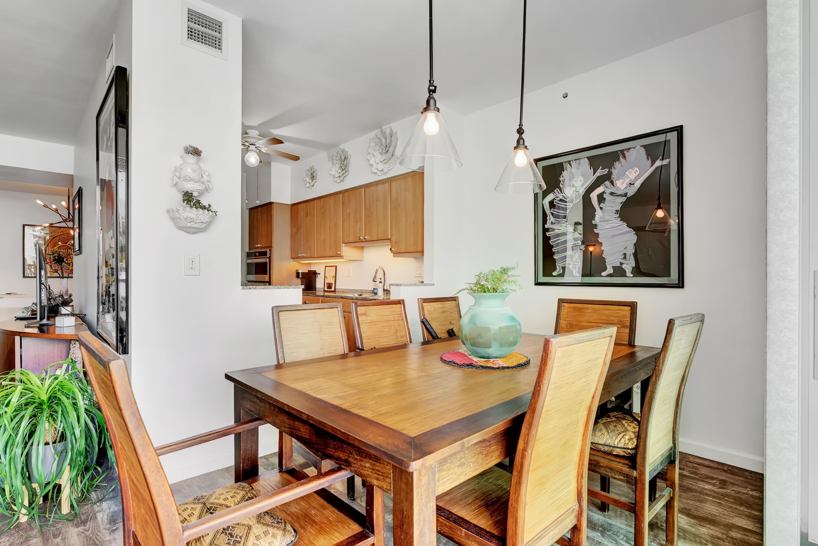 500 Southeast Mizner Boulevard, Unit A710 Boca Raton, FL 33432 - Photo 23 of 50 a view of a dining room with furniture and a potted plant