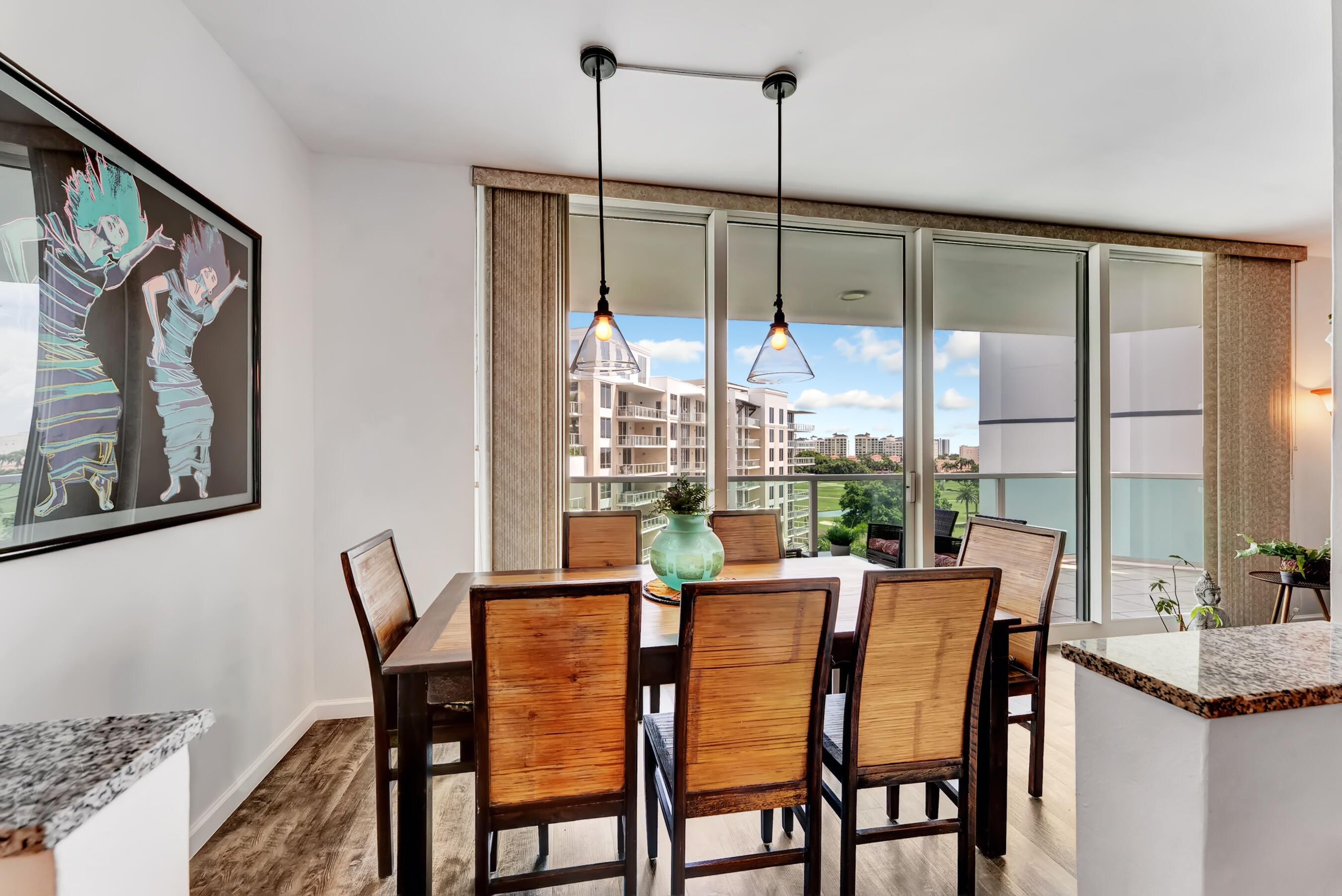 500 Southeast Mizner Boulevard, Unit A710 Boca Raton, FL 33432 - Photo 24 of 50 a view of a dining room with furniture window and wooden floor