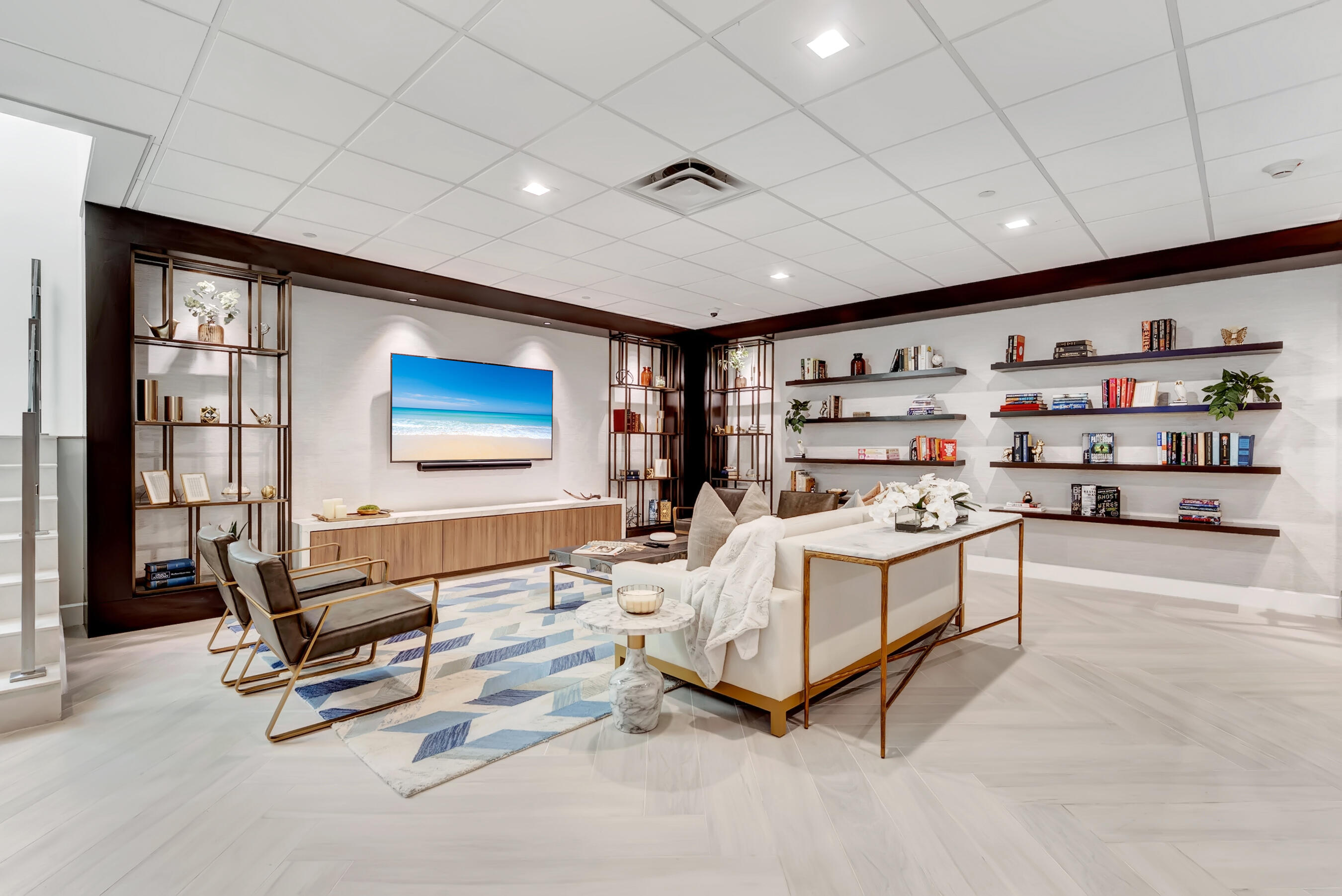 500 Southeast Mizner Boulevard, Unit A710 Boca Raton, FL 33432 - Photo 39 of 50 a living room with furniture gym equipment and a rug