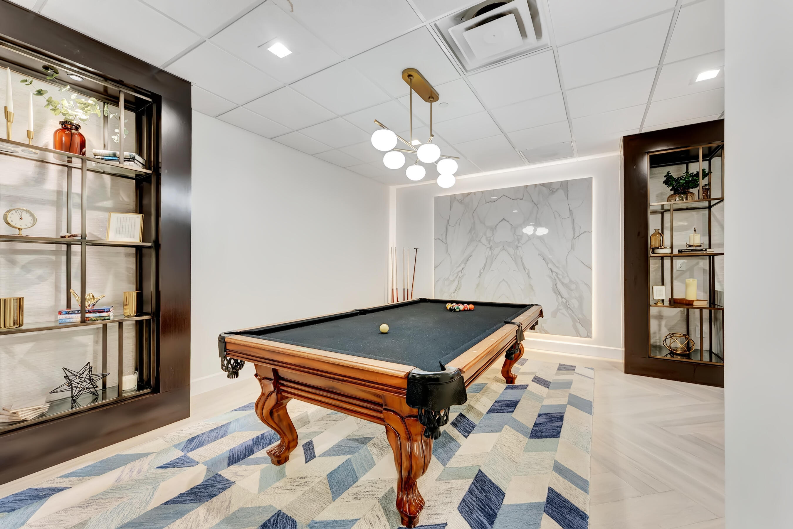 500 Southeast Mizner Boulevard, Unit A710 Boca Raton, FL 33432 - Photo 42 of 50 a room with pool table and a chandelier