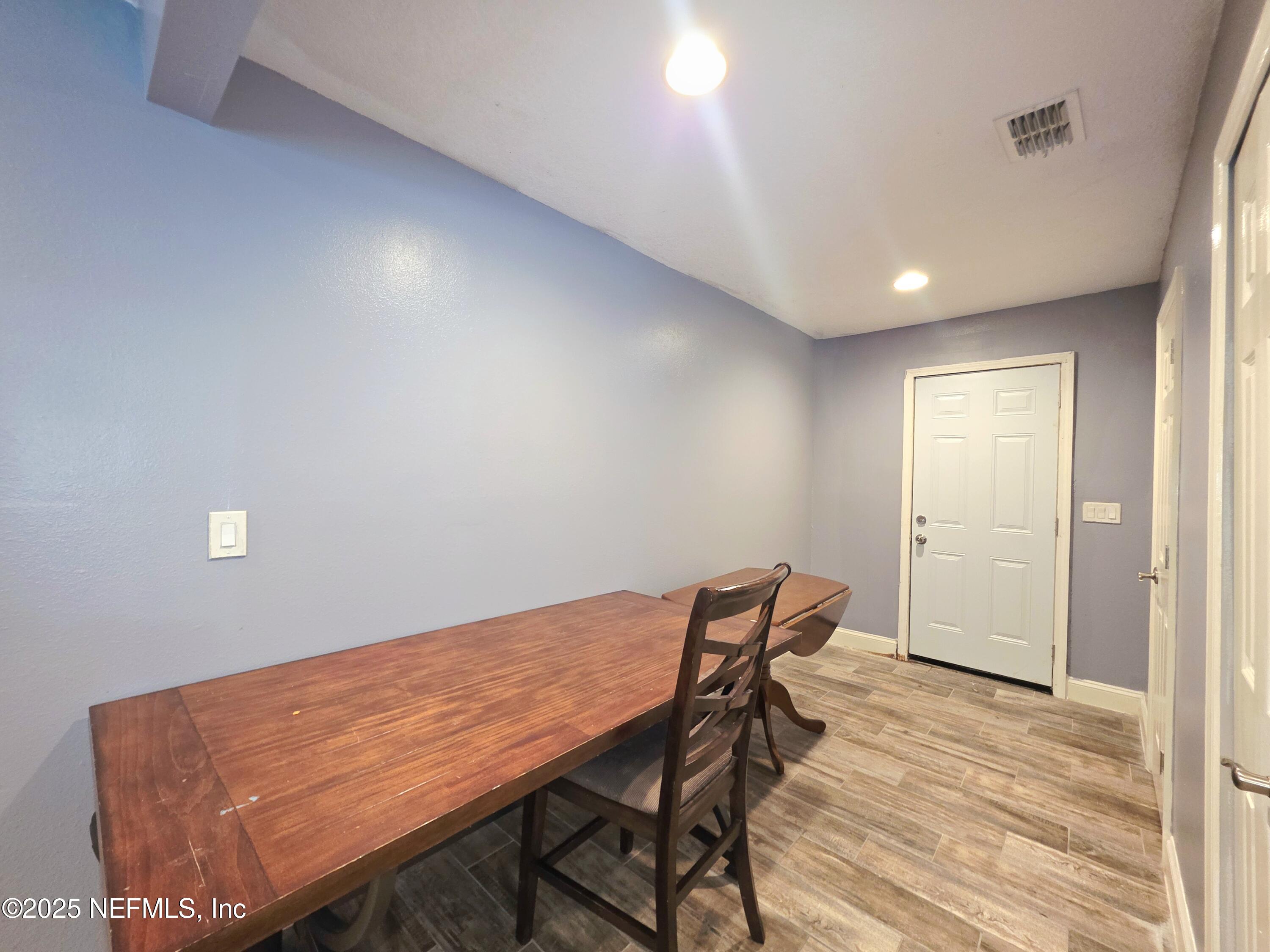 3065 Francis Road Jacksonville, FL 32209 - Photo 13 of 22 a view of a room with furniture and wooden floor