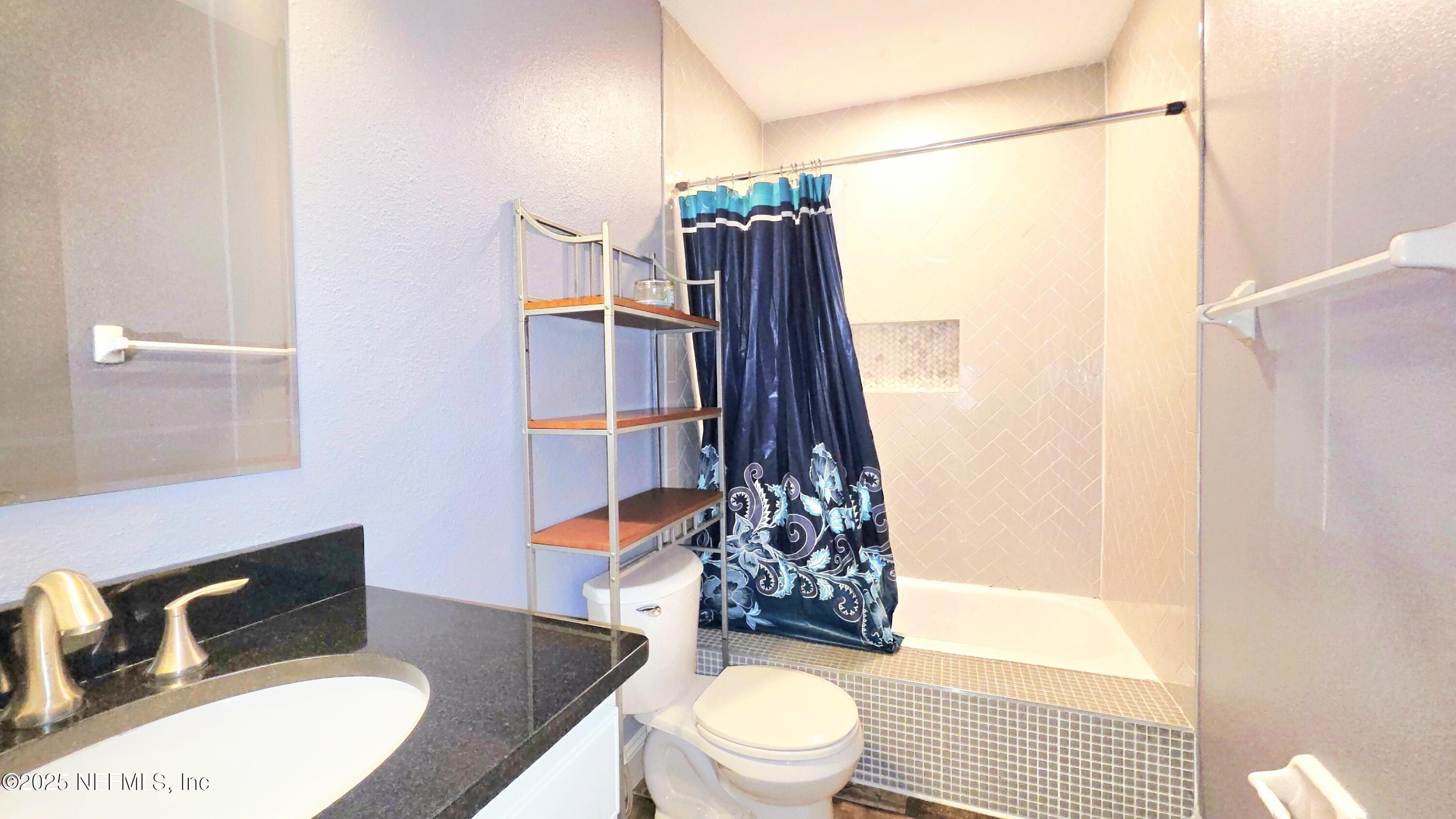 3065 Francis Road Jacksonville, FL 32209 - Photo 14 of 22 a bathroom with a sink toilet and shower