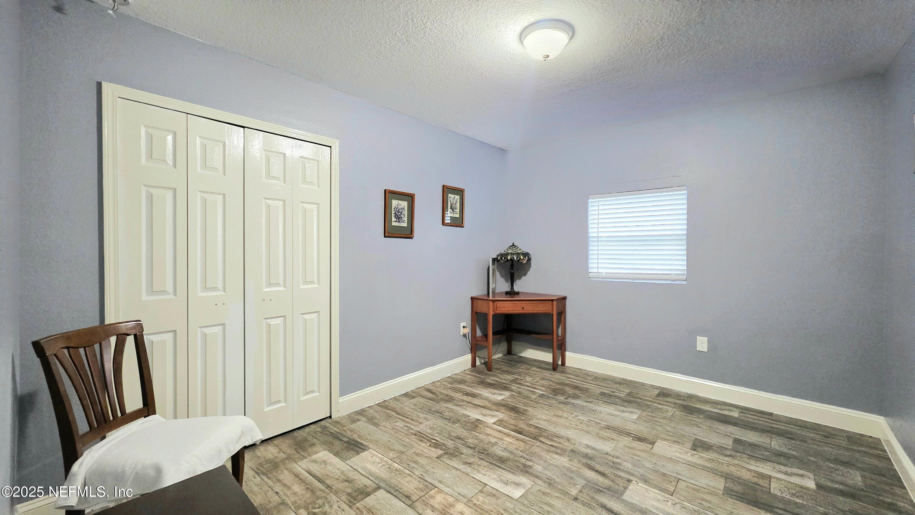 3065 Francis Road Jacksonville, FL 32209 - Photo 15 of 22 a bedroom with a bed and a window