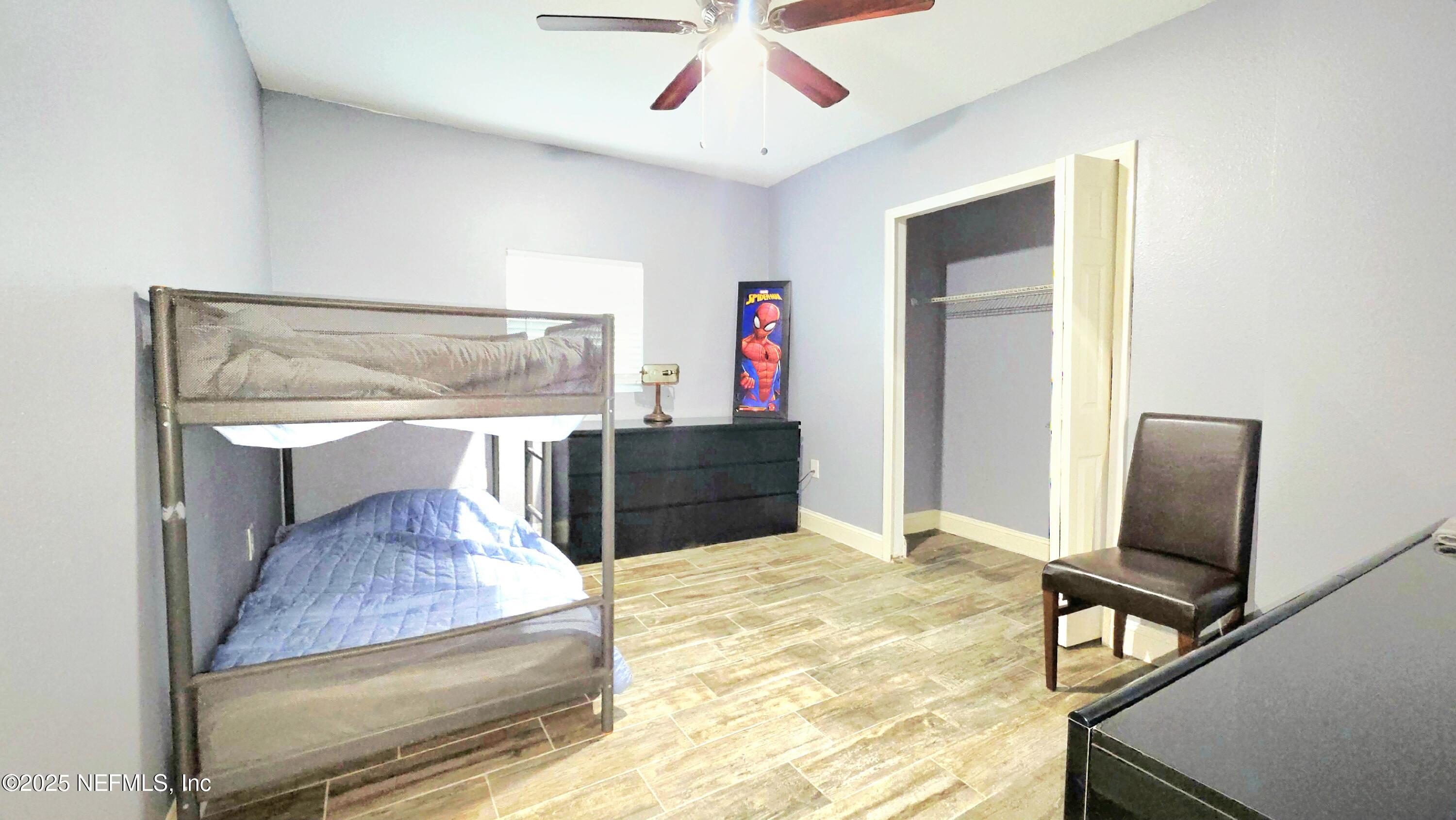 3065 Francis Road Jacksonville, FL 32209 - Photo 16 of 22 a living room with furniture and a flat screen tv