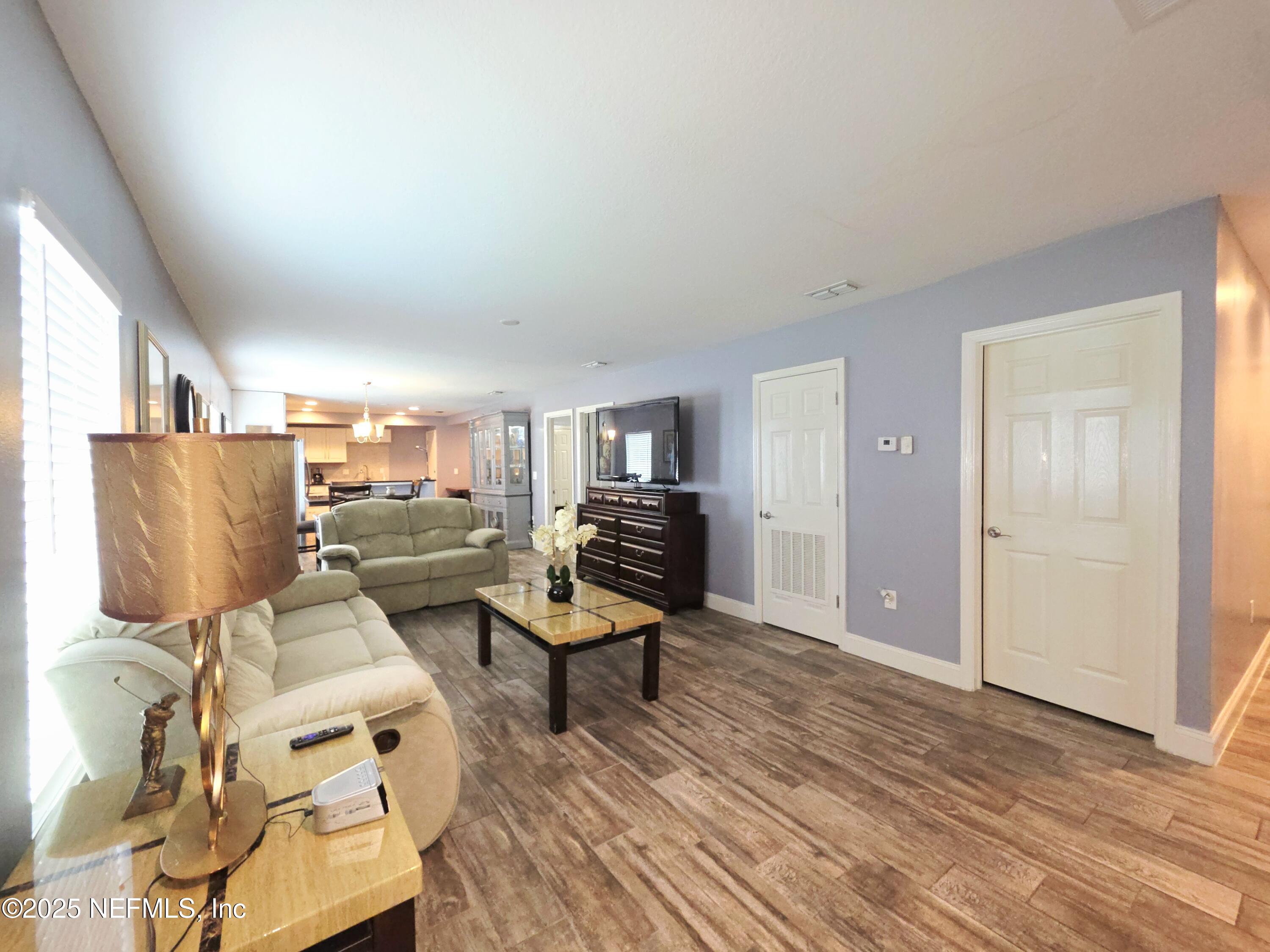 3065 Francis Road Jacksonville, FL 32209 - Photo 6 of 22 a living room with furniture and a wooden floor