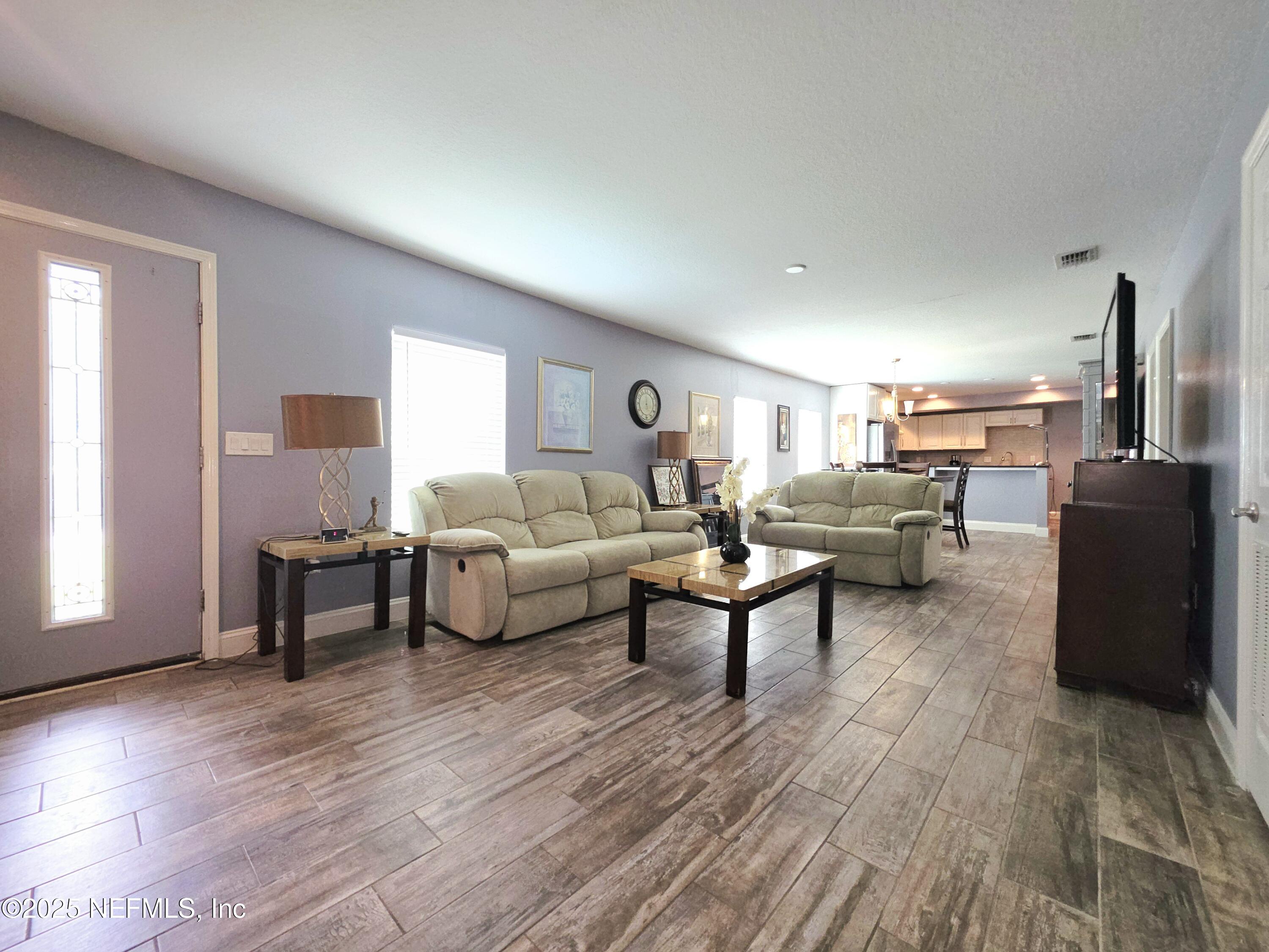 3065 Francis Road Jacksonville, FL 32209 - Photo 7 of 22 a living room with furniture and a wooden floor
