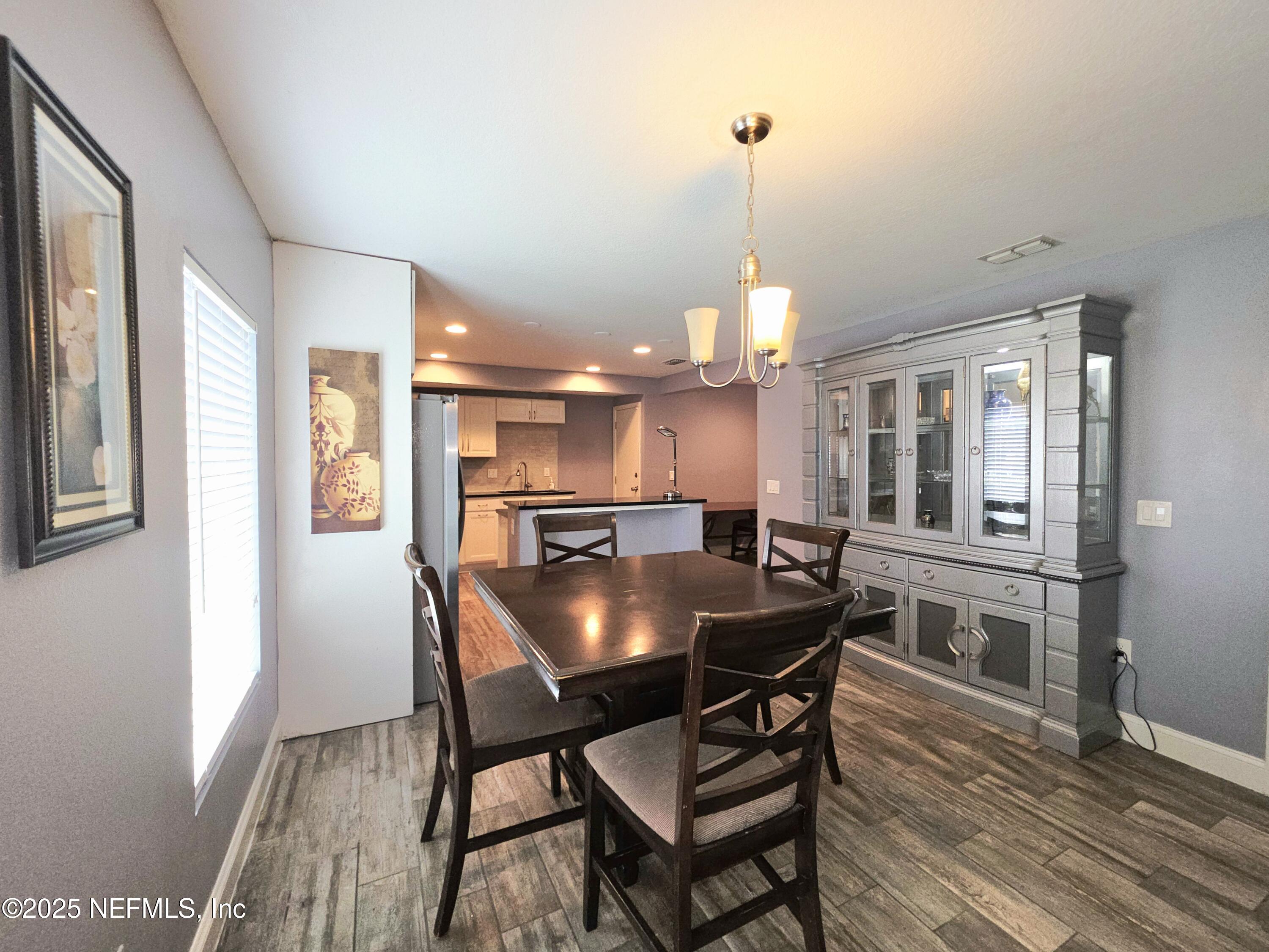 3065 Francis Road Jacksonville, FL 32209 - Photo 10 of 22 a kitchen with a table and chairs in it
