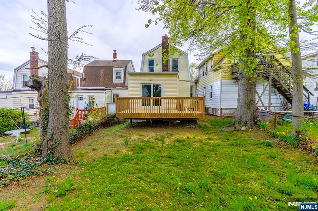 a view of a house with a back yard