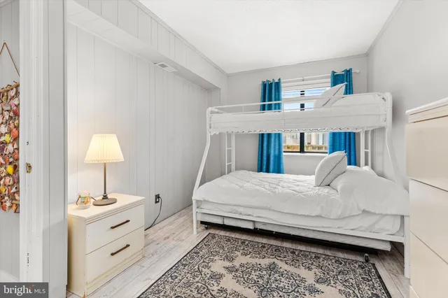 a bed room with a bed and a window