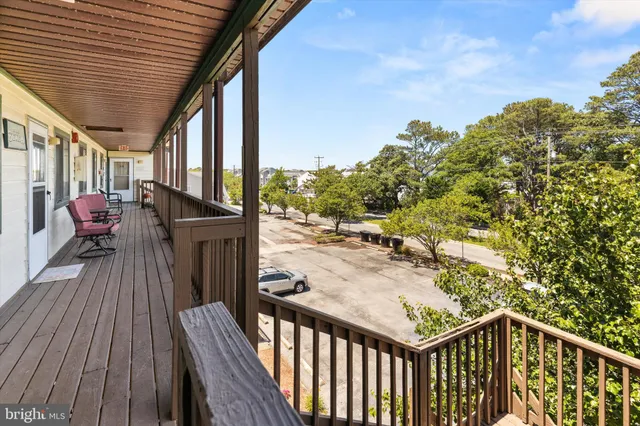 a view of a balcony with furniture