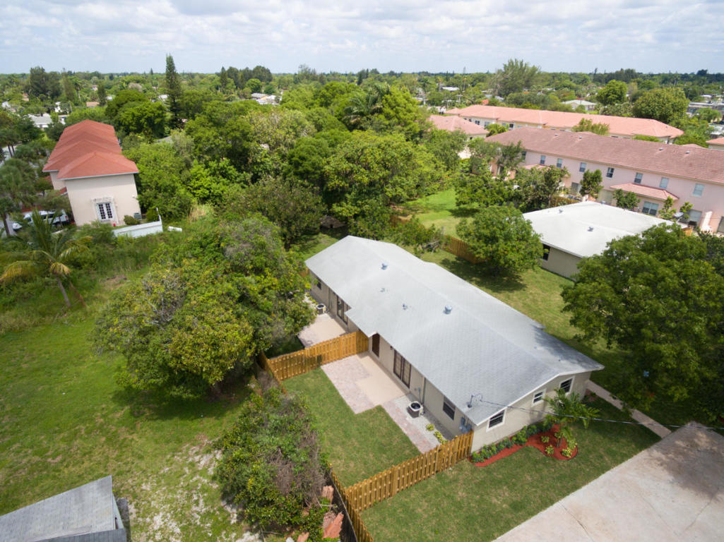31 Miller Road Palm Springs, FL 33461 - Photo 3 of 41 an aerial view of a house with a yard and plants