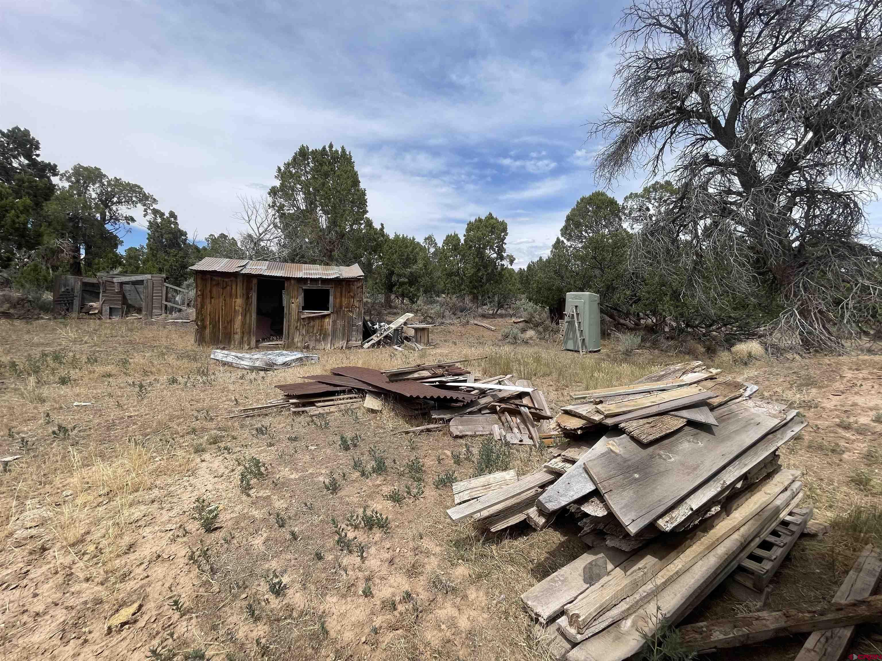 12753 Rd R Cahone, CO 81320 - Photo 14 of 24 a view of a backyard with chairs