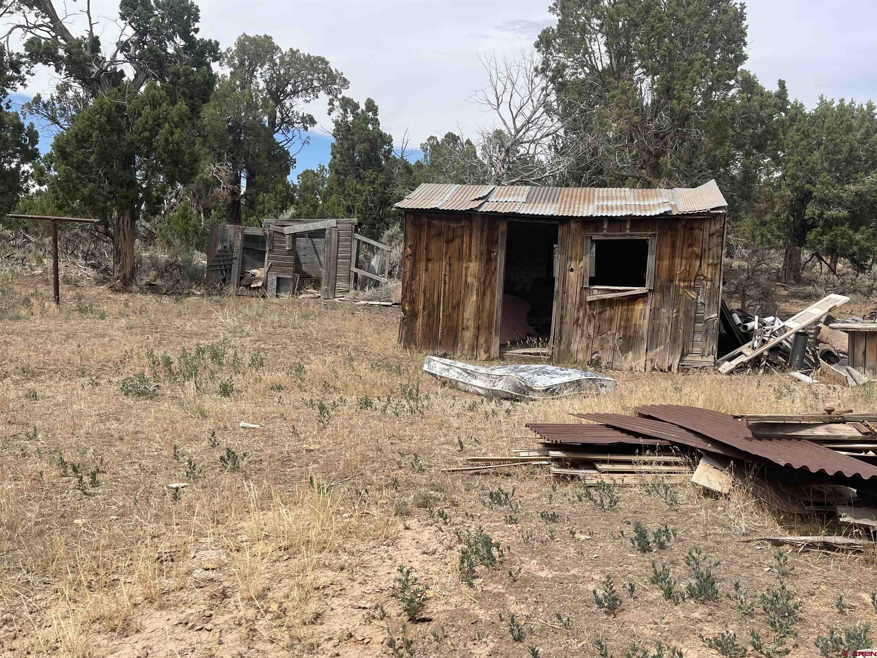 12753 Rd R Cahone, CO 81320 - Photo 15 of 24 a backyard of a house with table and chairs