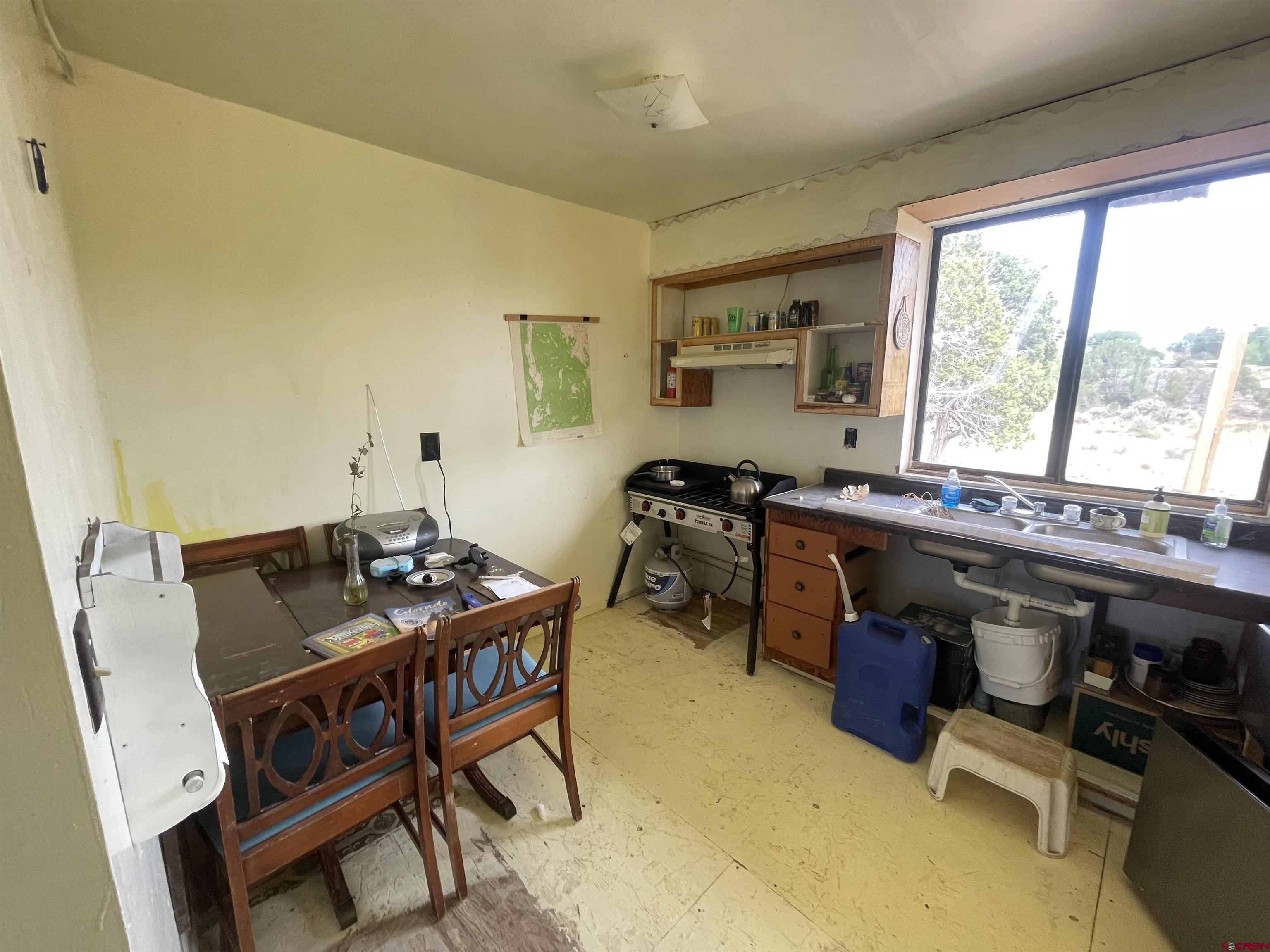 12753 Rd R Cahone, CO 81320 - Photo 6 of 24 a view of a workspace with furniture and a window