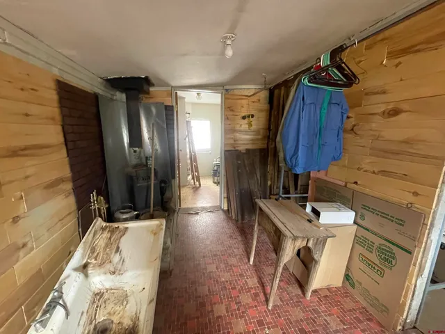 a bathroom with a sink mirror and a toilet