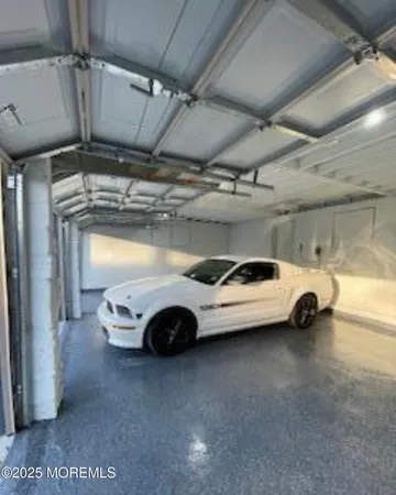 a view of parking garage with cars parked