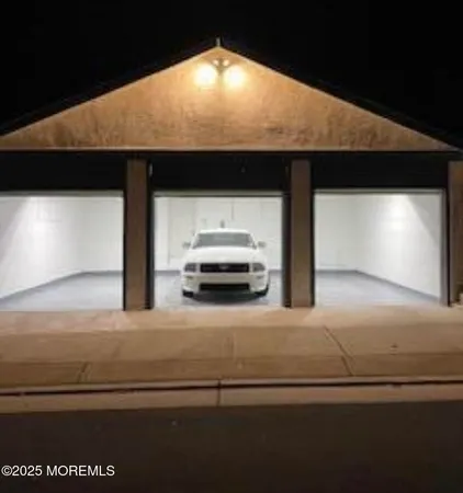 a view of parking garage with cars parked