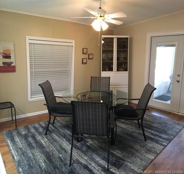 14514 Southwest Rake Drive Indiantown, FL 34956 - Photo 4 of 10 a view of a workspace with furniture and a window