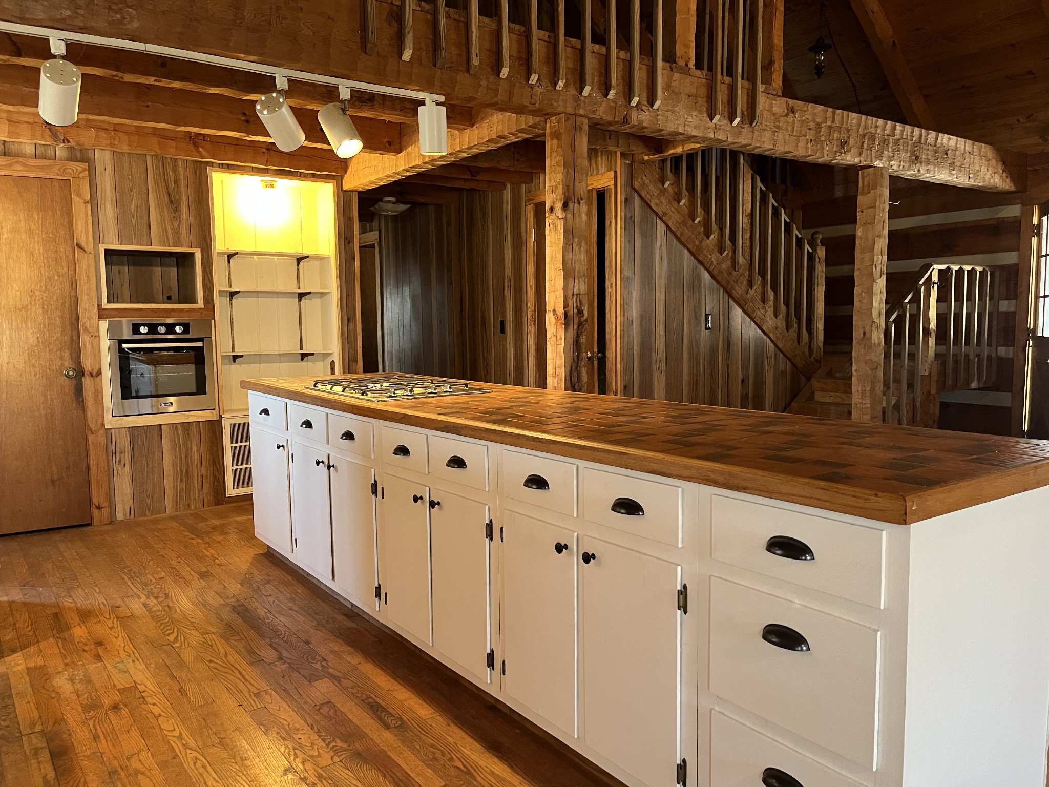 1012 Peery Road Kingston Springs, TN 37082 - Photo 11 of 34 a kitchen with cabinets and wooden floor