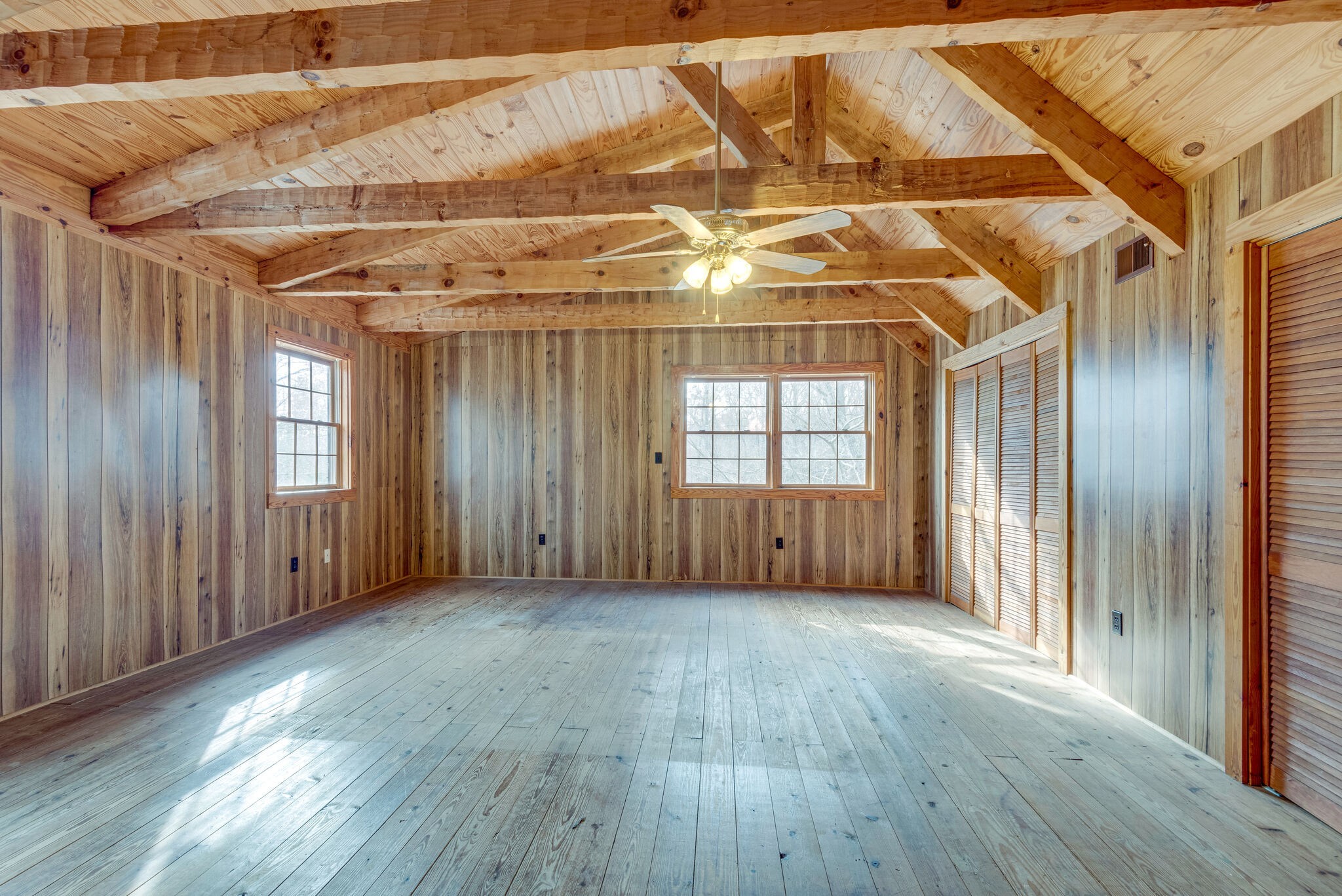 1012 Peery Road Kingston Springs, TN 37082 - Photo 14 of 34 an empty room with wooden floor and windows