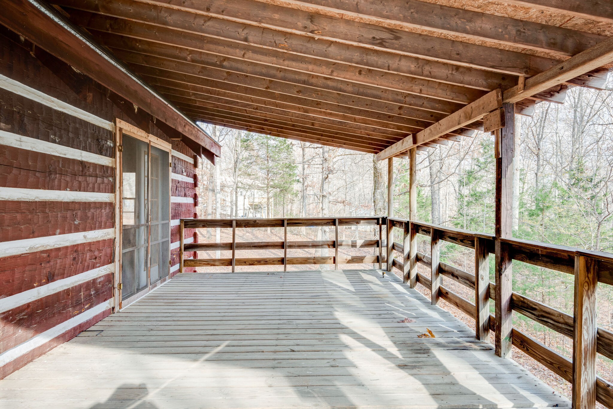 1012 Peery Road Kingston Springs, TN 37082 - Photo 24 of 34 a view of an empty room with wooden floor and a window