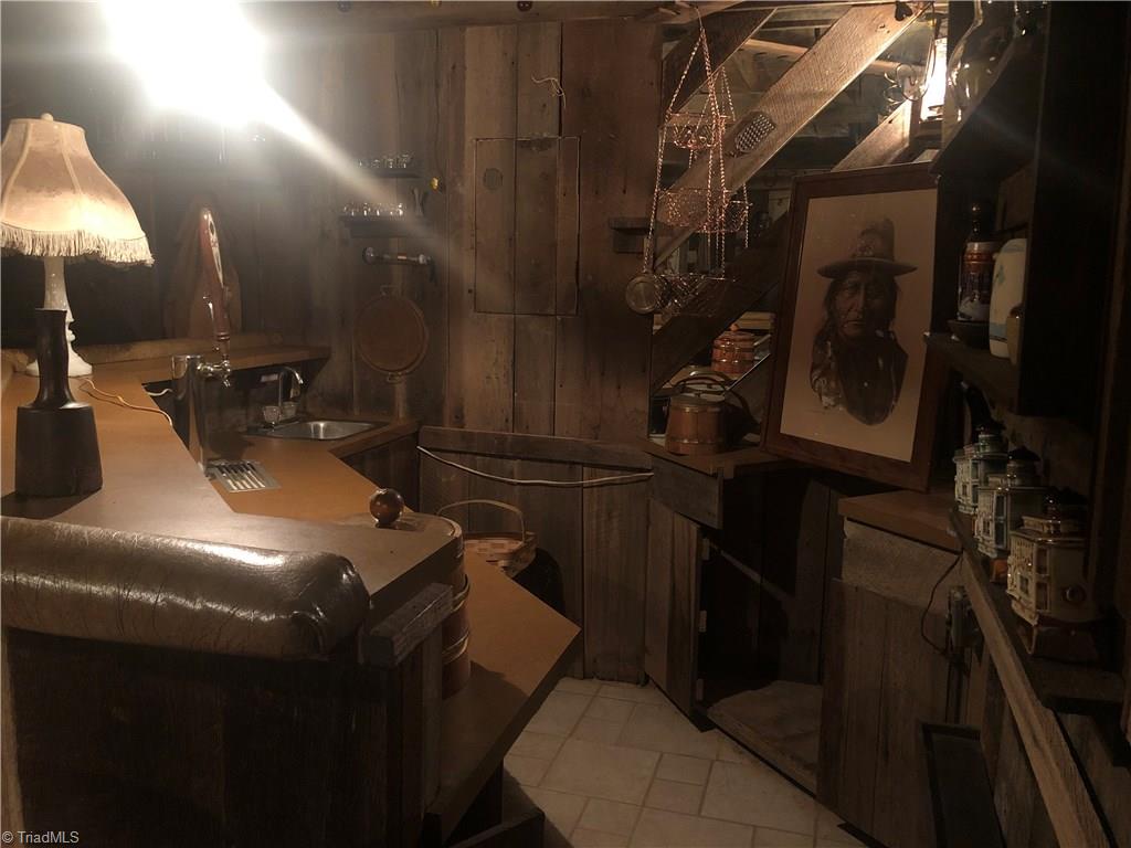 369 Cook Road Pilot Mountain, NC 27041 - Photo 22 of 30 Wet Bar area has beer keg cooler and small refrigerator.
