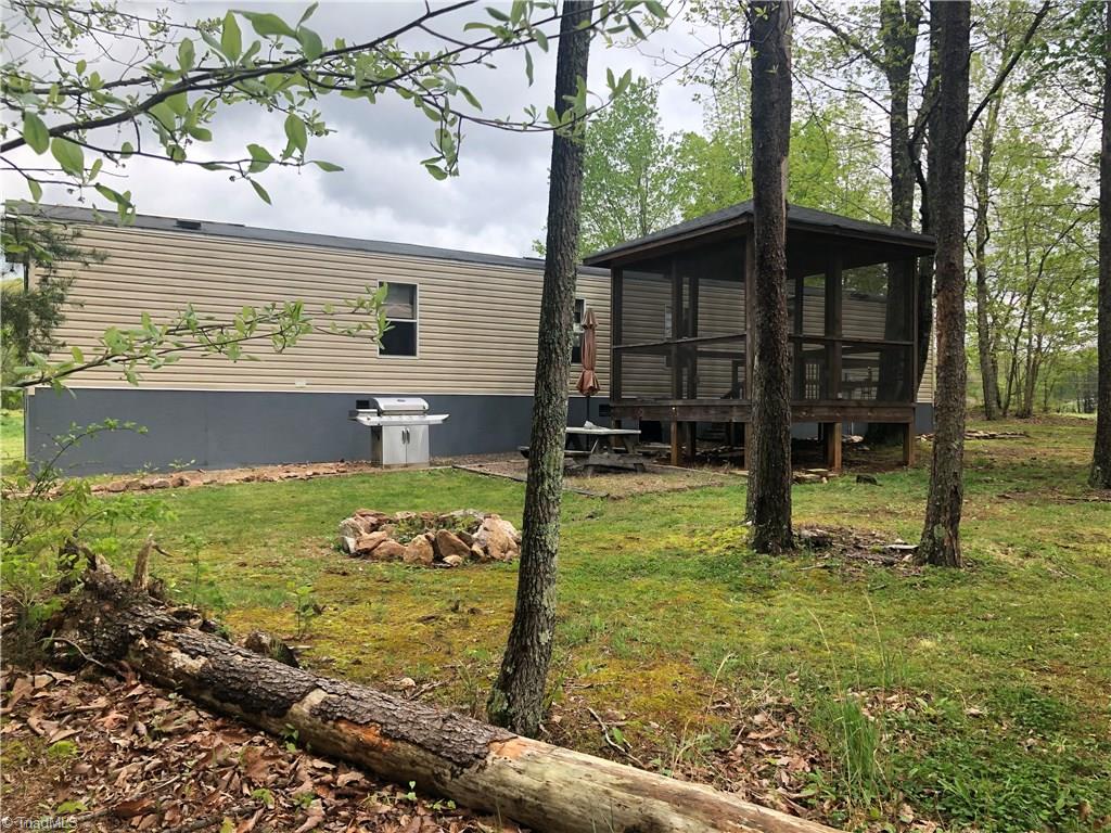 369 Cook Road Pilot Mountain, NC 27041 - Photo 26 of 30 Back Yard of single wide home.