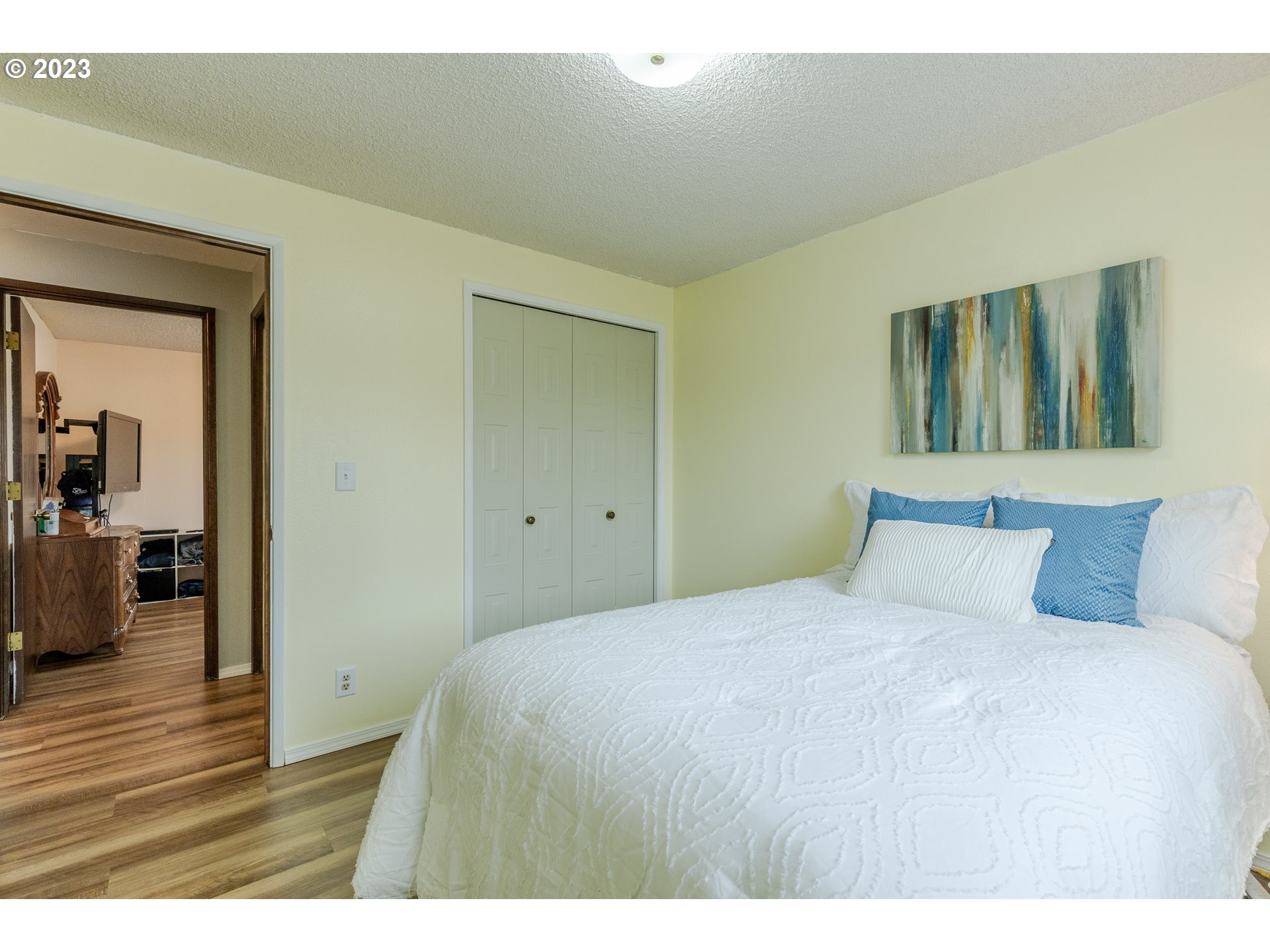 316 70th Street Springfield, OR 97478 - Photo 14 of 25 a bedroom with a bed and wooden floor