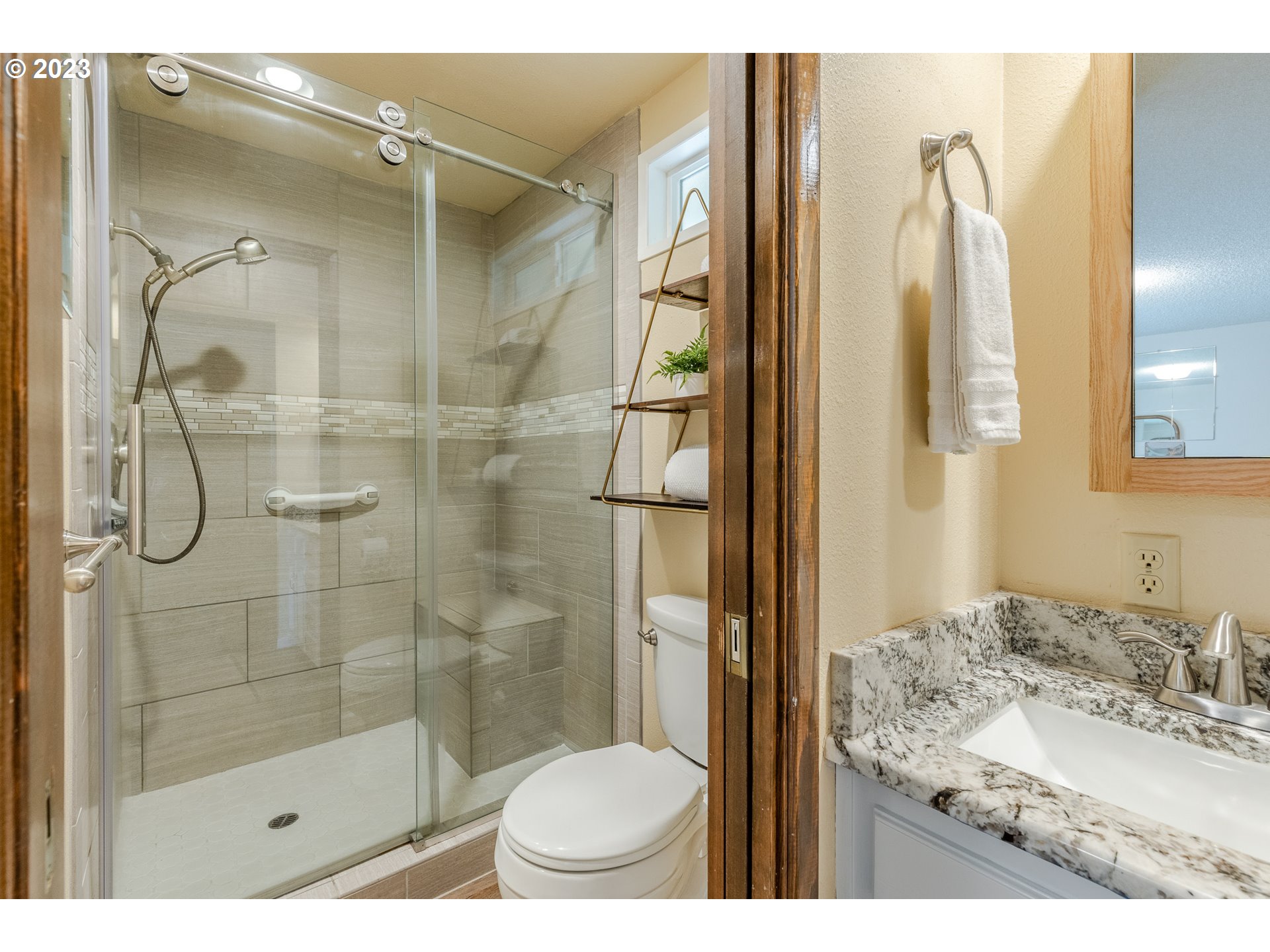 316 70th Street Springfield, OR 97478 - Photo 17 of 25 a bathroom with a granite countertop sink toilet and shower