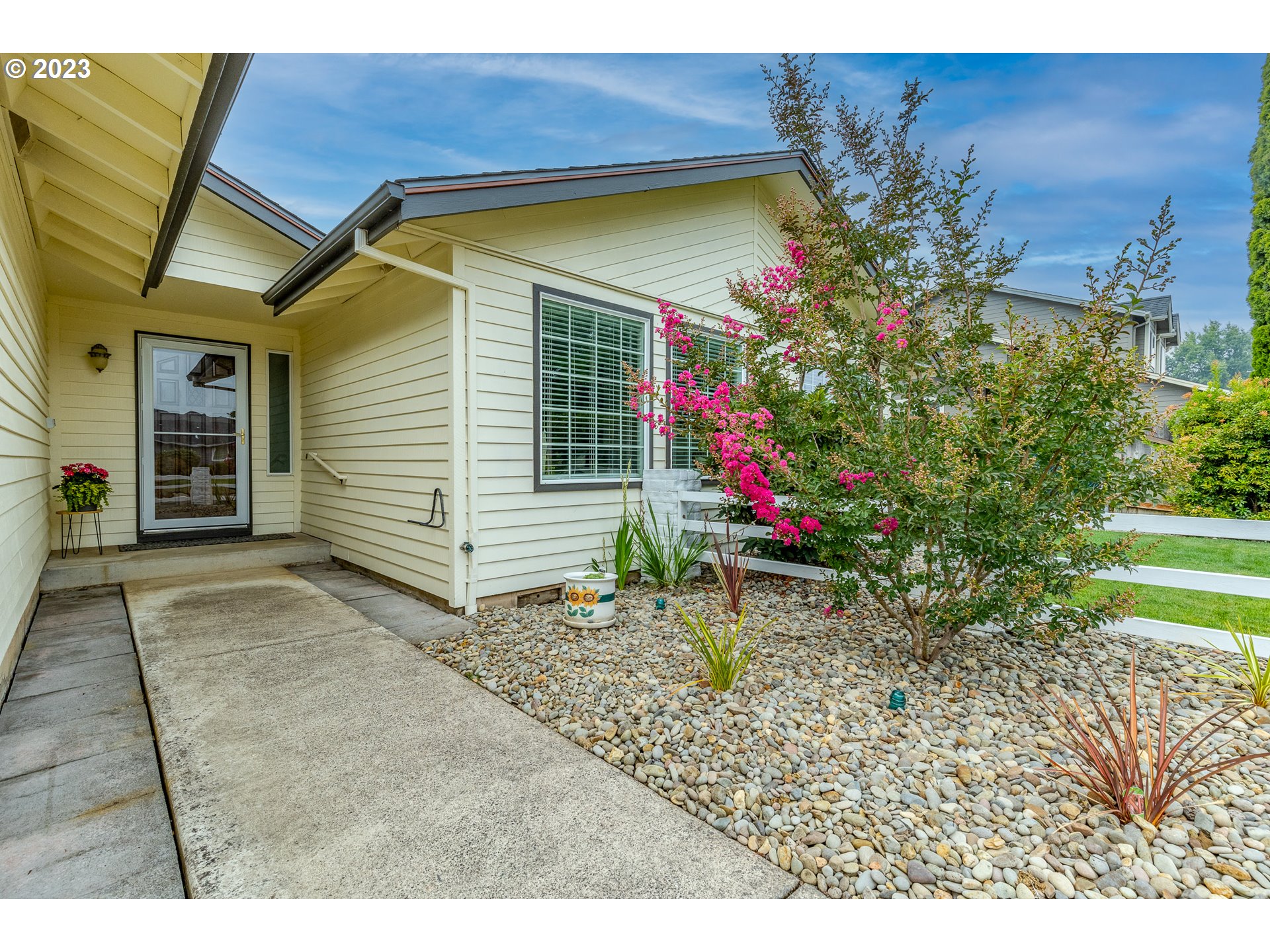 316 70th Street Springfield, OR 97478 - Photo 3 of 25 a backyard of a house with yard and outdoor seating