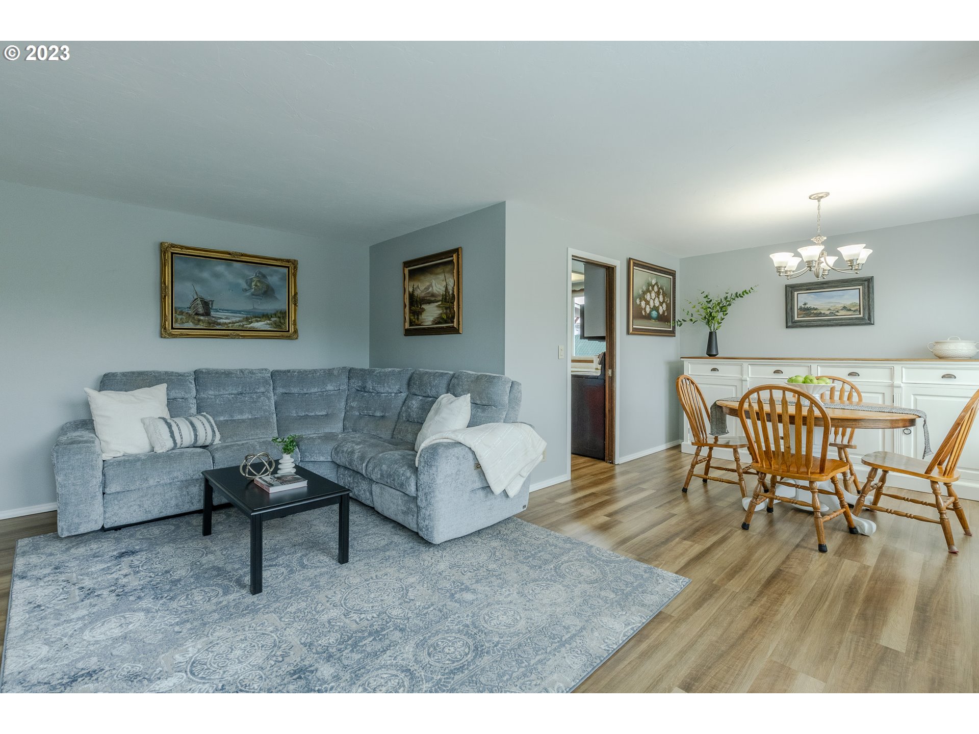 316 70th Street Springfield, OR 97478 - Photo 6 of 25 a living room with furniture and a wooden floor