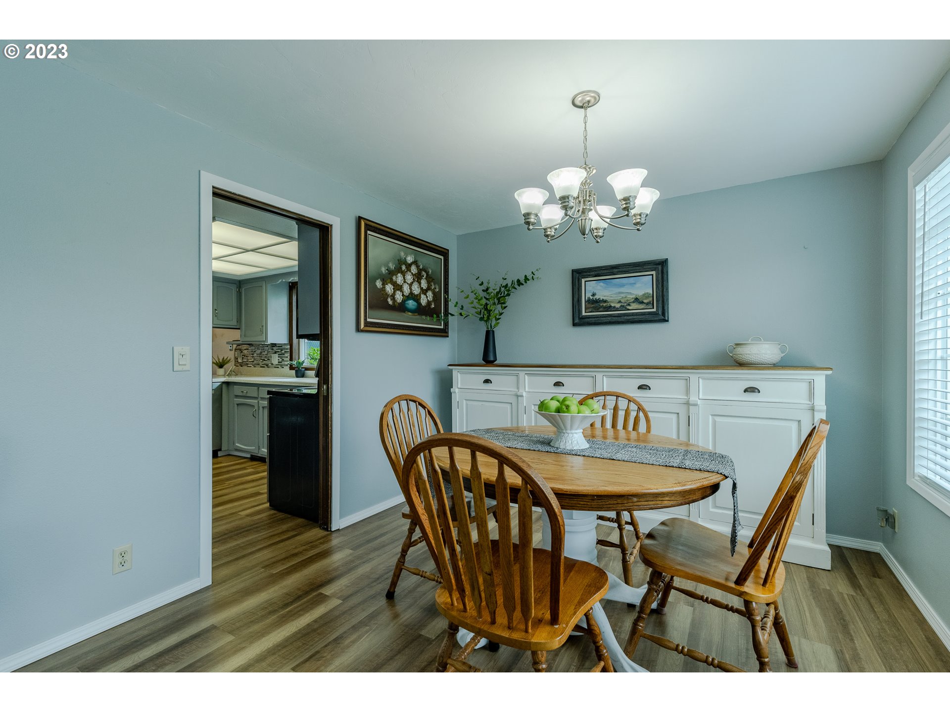 316 70th Street Springfield, OR 97478 - Photo 7 of 25 a dining room with furniture and chandelier