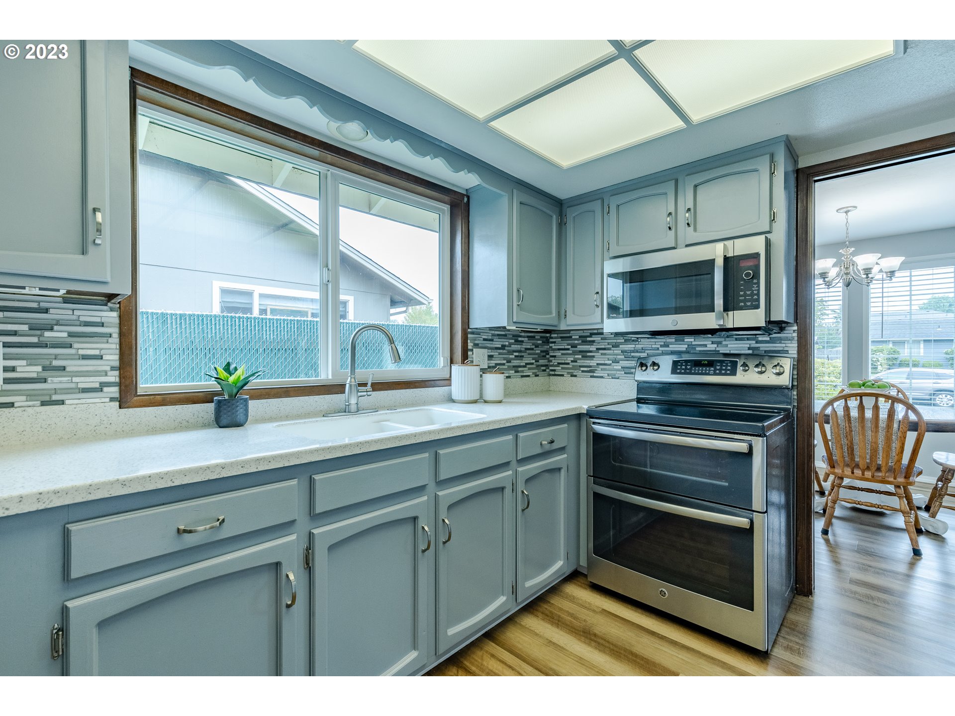 316 70th Street Springfield, OR 97478 - Photo 10 of 25 a kitchen with a sink appliances and cabinets