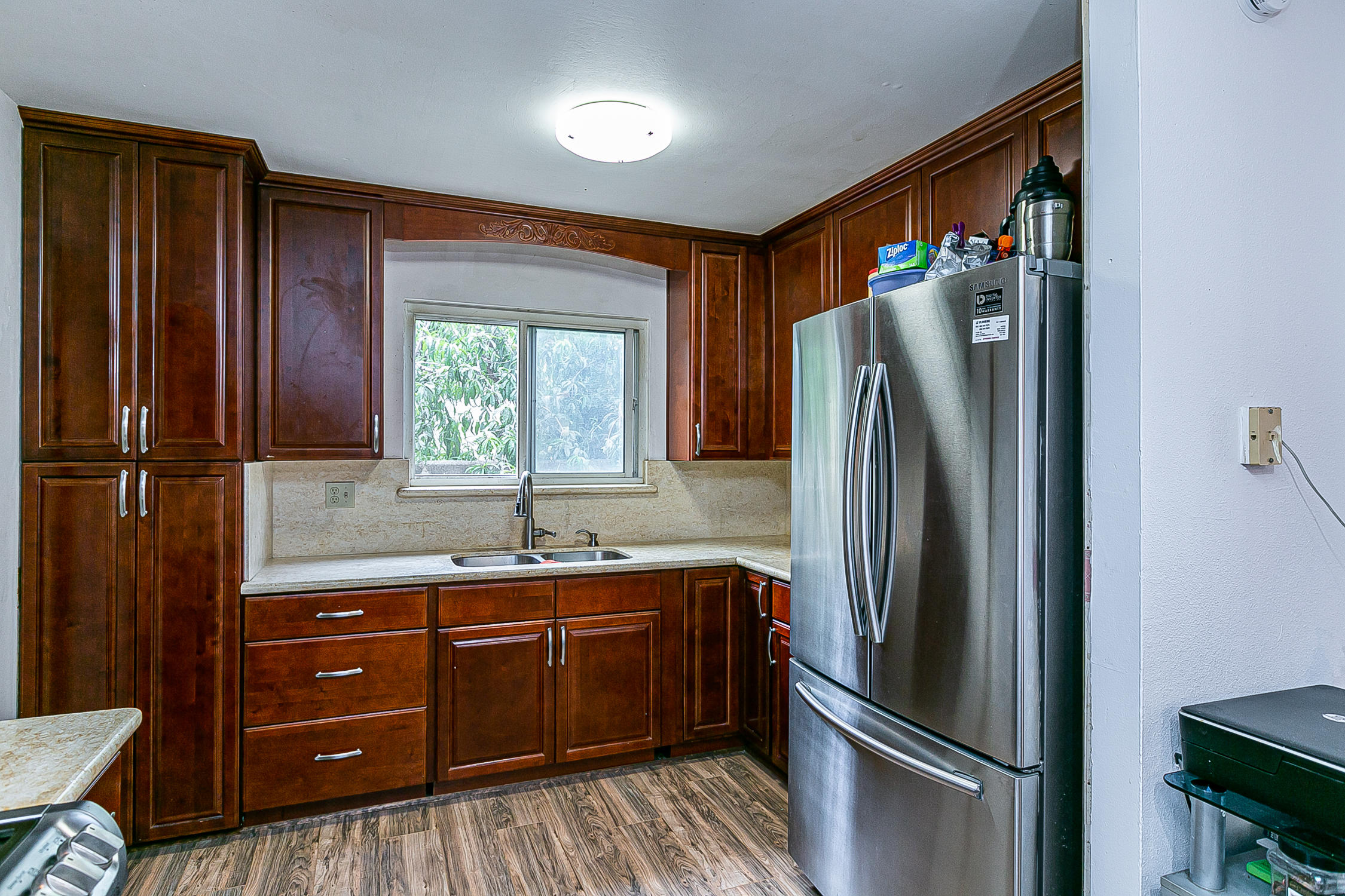 321 South T Street Lompoc, CA 93436 - Photo 12 of 29 a kitchen with stainless steel appliances granite countertop a refrigerator and a sink