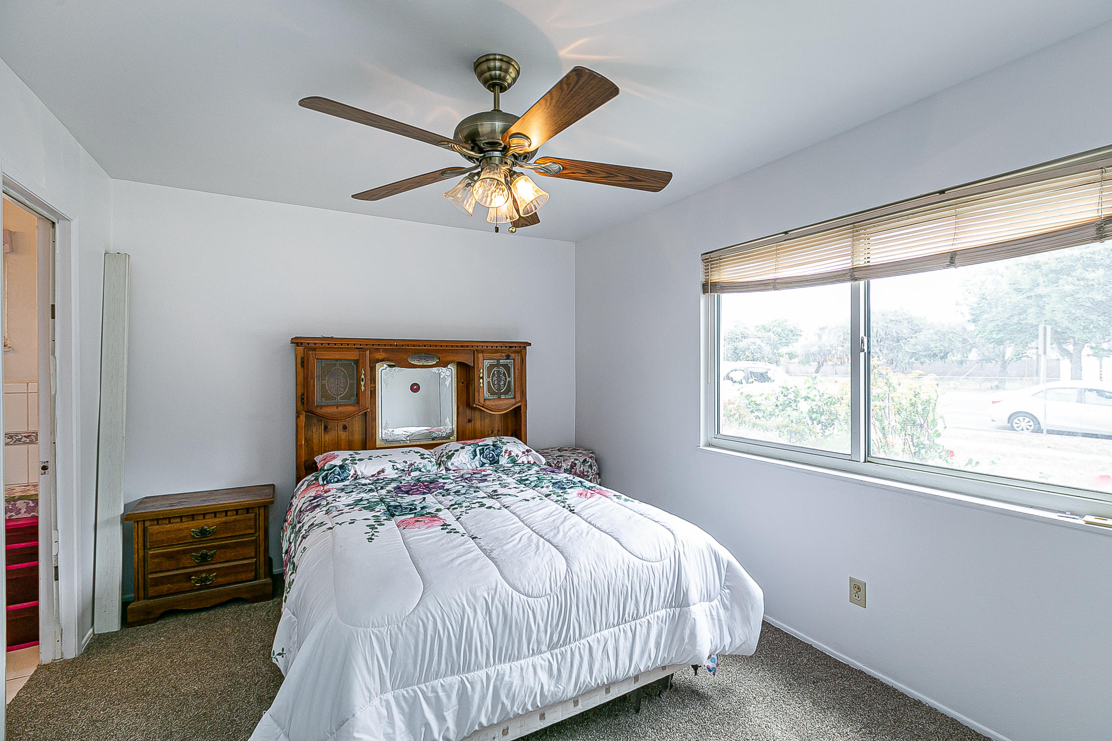 321 South T Street Lompoc, CA 93436 - Photo 15 of 29 a bedroom with a bed and a window