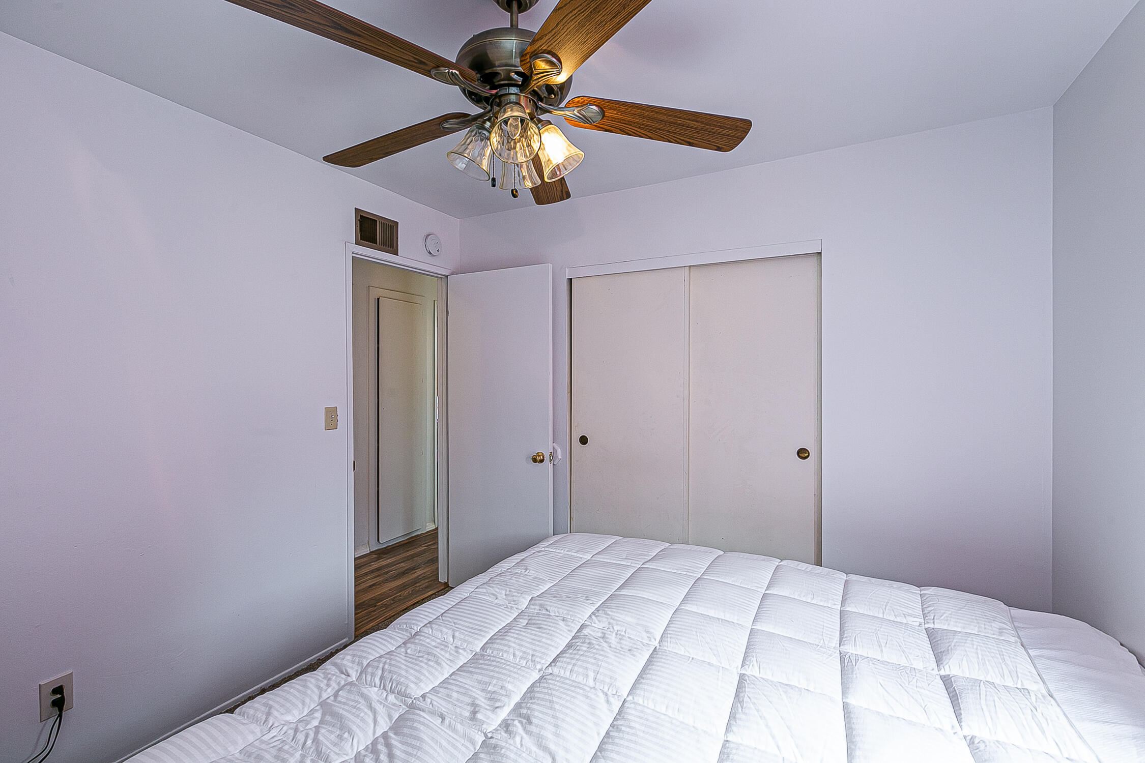 321 South T Street Lompoc, CA 93436 - Photo 24 of 29 a bedroom with a bed and a chandelier